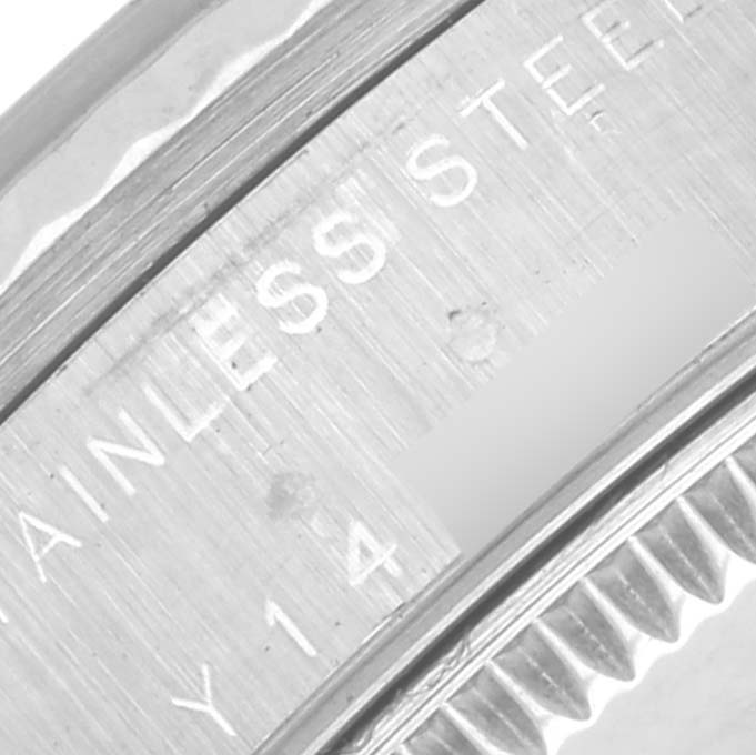 The image shows a close-up of the bezel and part of the case of a Rolex Mid-Size 78274 Women's Stainless Steel Mother of Pearl Dial 78274 Women's Stainless Steel Mother of Pearl Dial watch, highlighting the "STAINLESS STEEL" engraving.