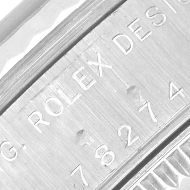 The image shows a close-up of the side engraving on a Rolex Mid-Size 78274 Women's Stainless Steel Mother of Pearl Dial 78274 Women's Stainless Steel Mother of Pearl Dial model, including the "ROLEX DESIGN" label and serial numbers.