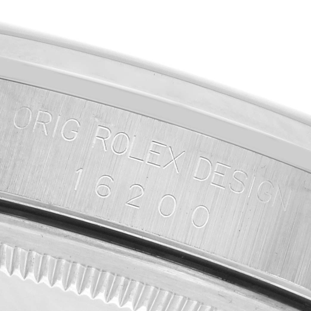 The image shows the inner engraving on the case of a Rolex Datejust 16200 Men's Stainless Steel Pink Dial 16200 Men's Stainless Steel Pink Dial, displaying the model number 16200.