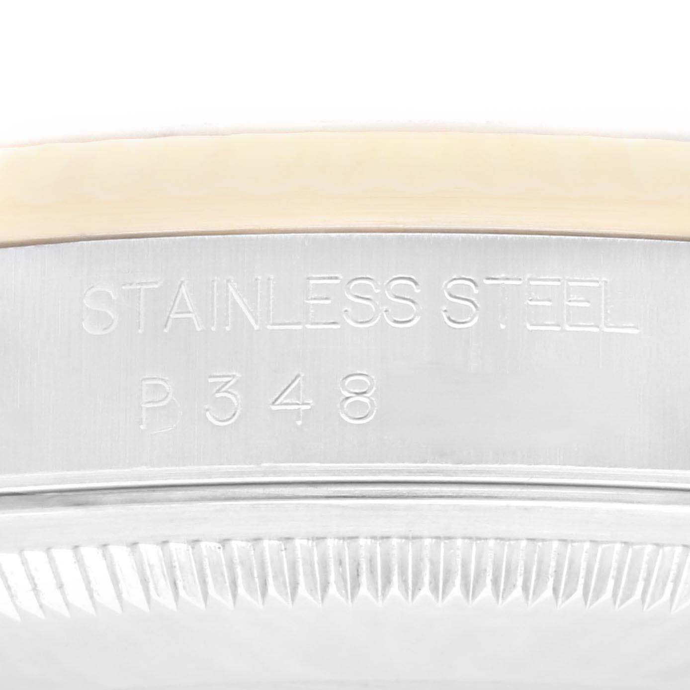 This image shows a close-up of the stainless steel casing with engraved numbers and text on a Rolex Datejust 16233 Men's Steel and Gold (two tone) Champagne Dial 16233 Men's Steel and Gold (two tone) Champagne Dial watch.