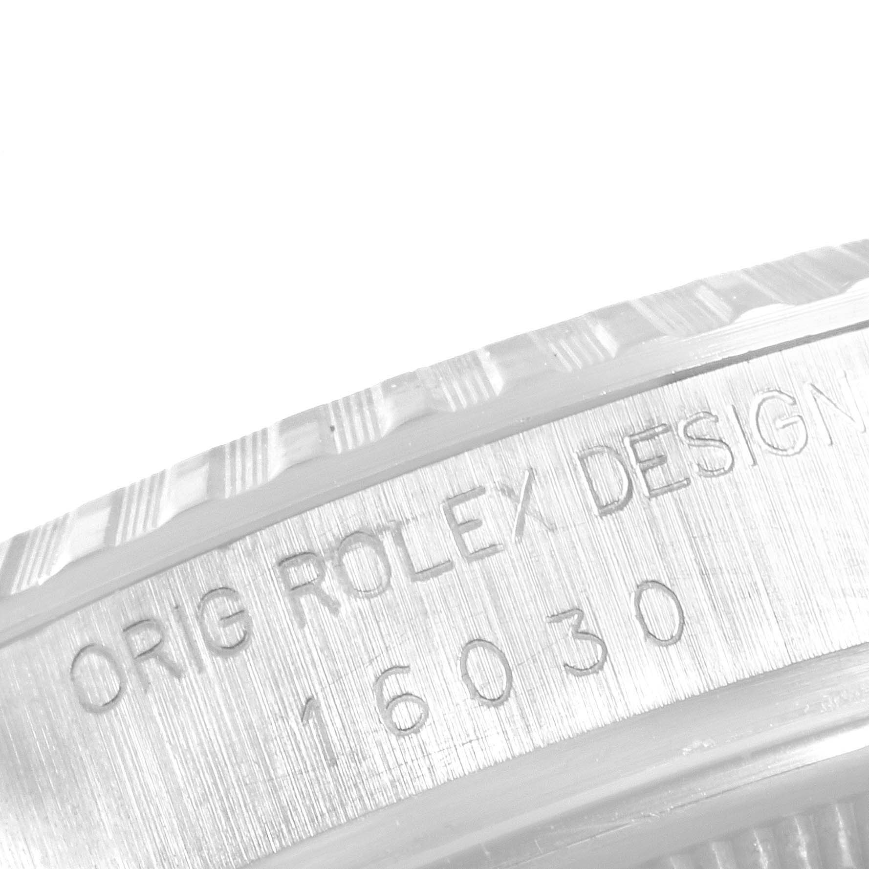 The image shows a close-up of the side of the case of a Rolex Vintage Collection 16030 Men's Stainless Steel Brown Dial 16030 Men's Stainless Steel Brown Dial model, focusing on the engraved design number "16030."