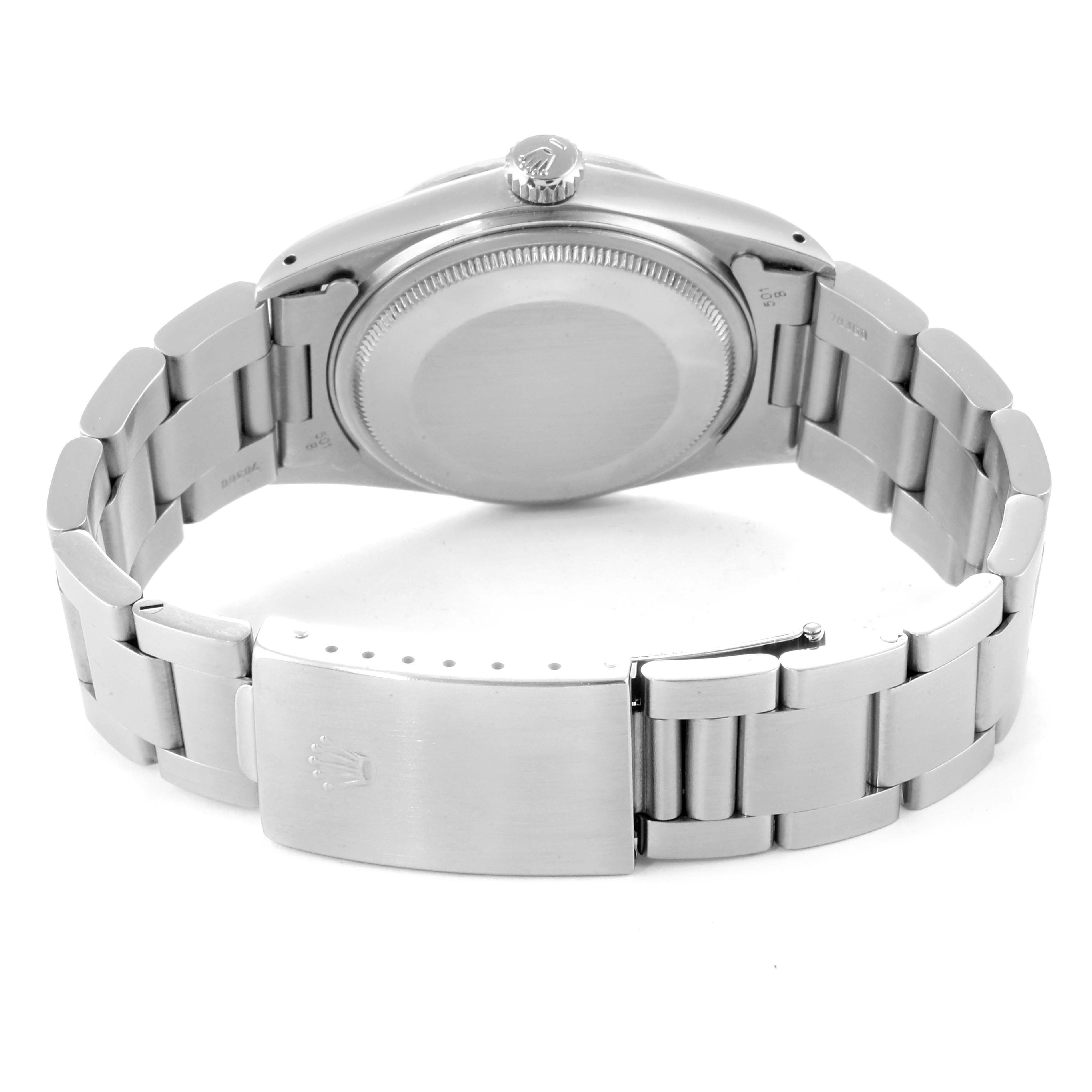 The image shows the back view of the Vintage Collection watch by Rolex, focusing on the case back, crown, and bracelet with clasp.