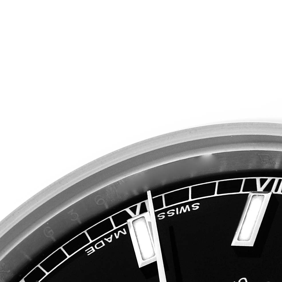 The image shows a close-up of the Rolex Mid-Size 178240 Women's Stainless Steel Black Dial 178240 Women's Stainless Steel Black Dial watch face, highlighting the dial and hour markers from an angled view.