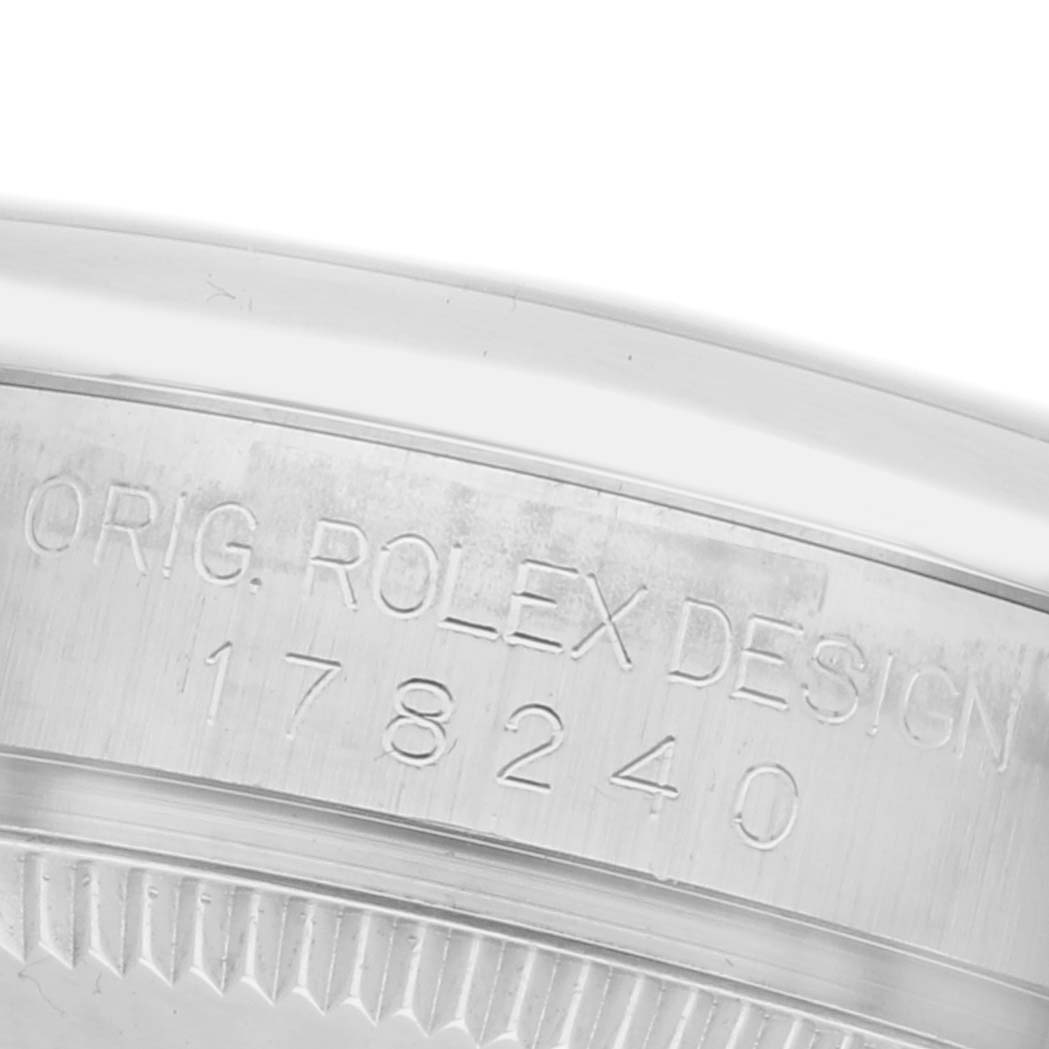 This image shows a close-up of the edge of a Rolex Mid-Size 178240 Women's Stainless Steel Black Dial 178240 Women's Stainless Steel Black Dial model, highlighting the model number "178240" and engraved design details.
