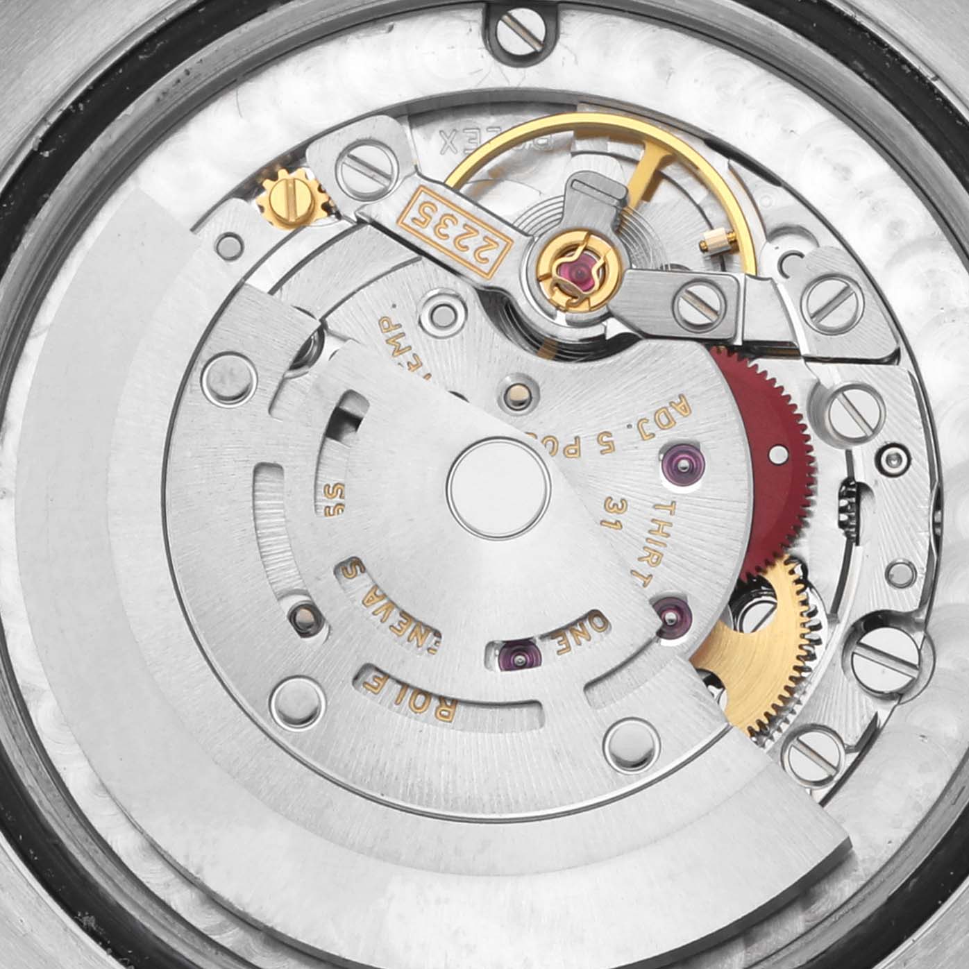 This image shows the internal mechanism of a Rolex Mid-Size 178274 Women's Stainless Steel Mother of Pearl Dial 178274 Women's Stainless Steel Mother of Pearl Dial watch viewed from the back, highlighting gears and rotors.