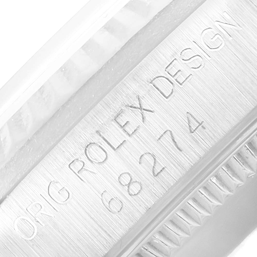 This image shows a close-up of the case side and engraving of a Mid-Size Rolex watch, displaying the model number 68274 and "ROLEX DESIGN."