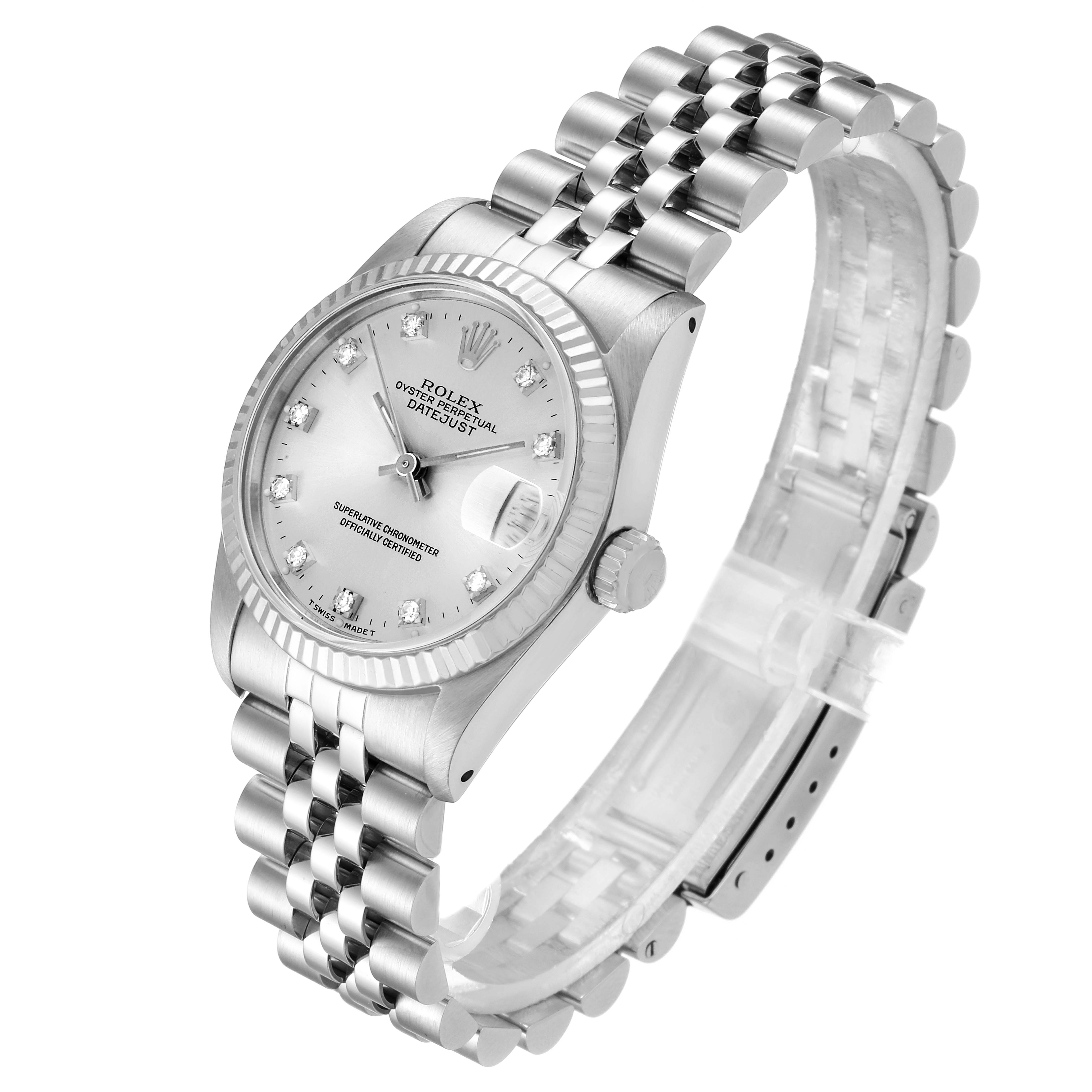 The Rolex Mid-Size 68274 Women
s Stainless Steel Silver Dial 68274 Women
s Stainless Steel Silver Dial Datejust watch is shown at a three-quarter angle, displaying its face, bracelet, and crown.