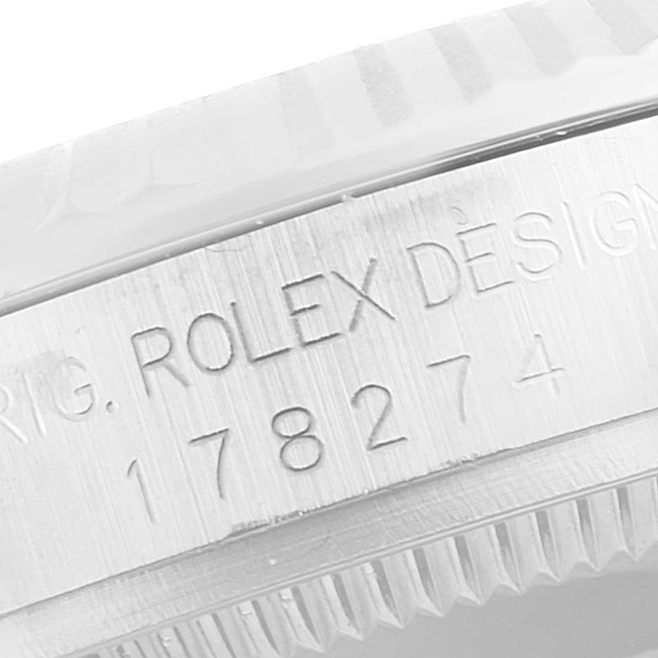 Close-up view of the bezel and engraving on a Mid-Size Rolex watch.