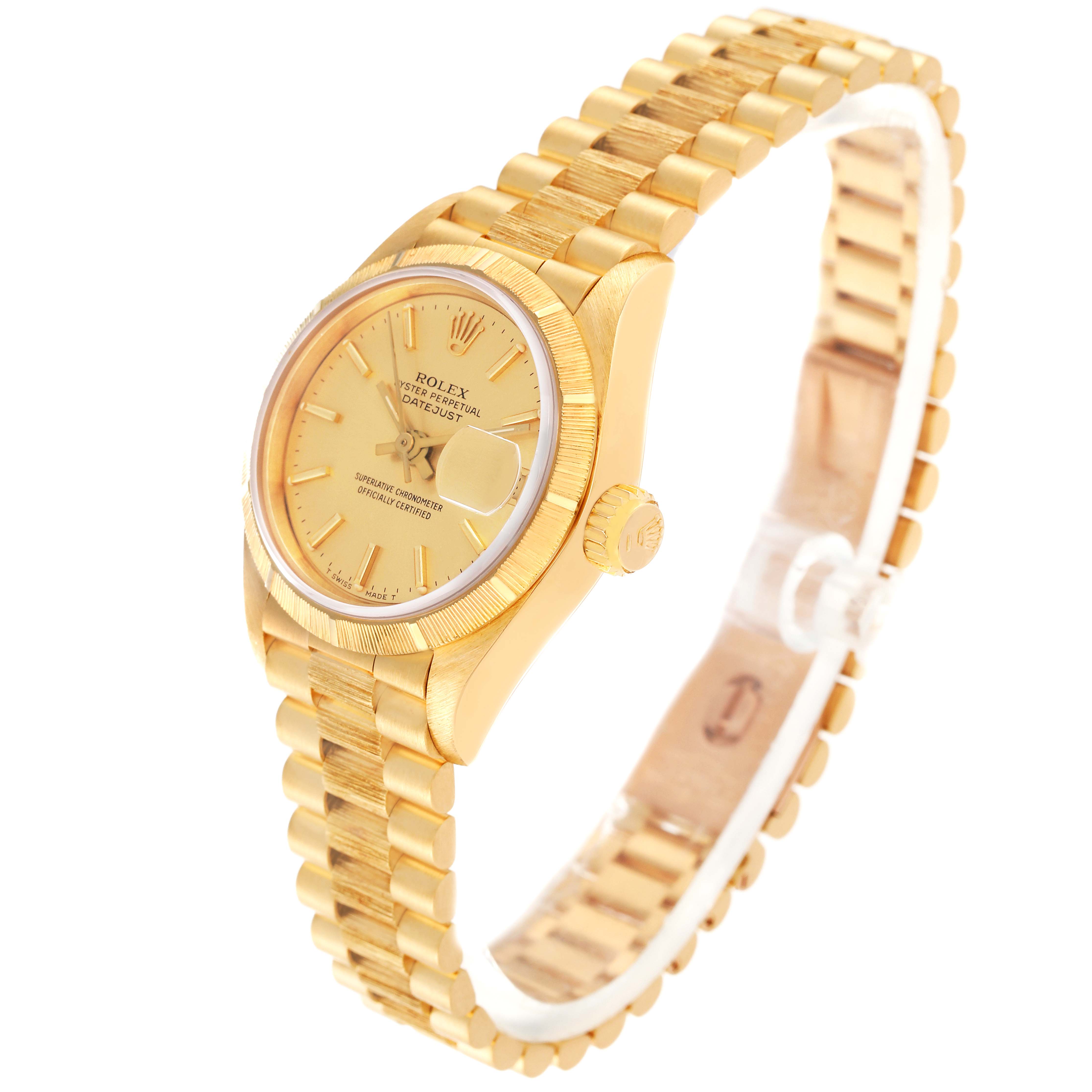 The Rolex President 69278 Women's Yellow Gold Champagne Dial 69278 Women's Yellow Gold Champagne Dial model watch is shown from a three-quarter angle, displaying its gold case, dial, fluted bezel, crown, and bracelet.