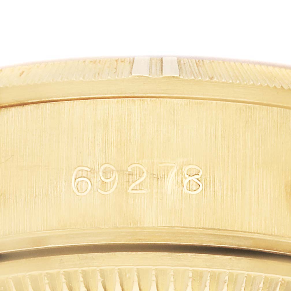 This close-up image of a Rolex President 69278 Women's Yellow Gold Champagne Dial 69278 Women's Yellow Gold Champagne Dial watch shows the engraved model number "69278" on the case.