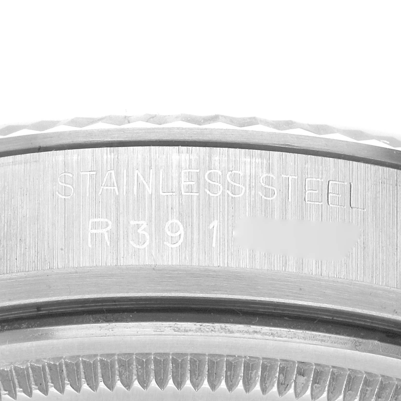 The image shows a close-up view of the side of a Rolex Vintage Collection 16014 Men's Stainless Steel Silver Dial 16014 Men's Stainless Steel Silver Dial watch, displaying the "STAINLESS STEEL" engraving.