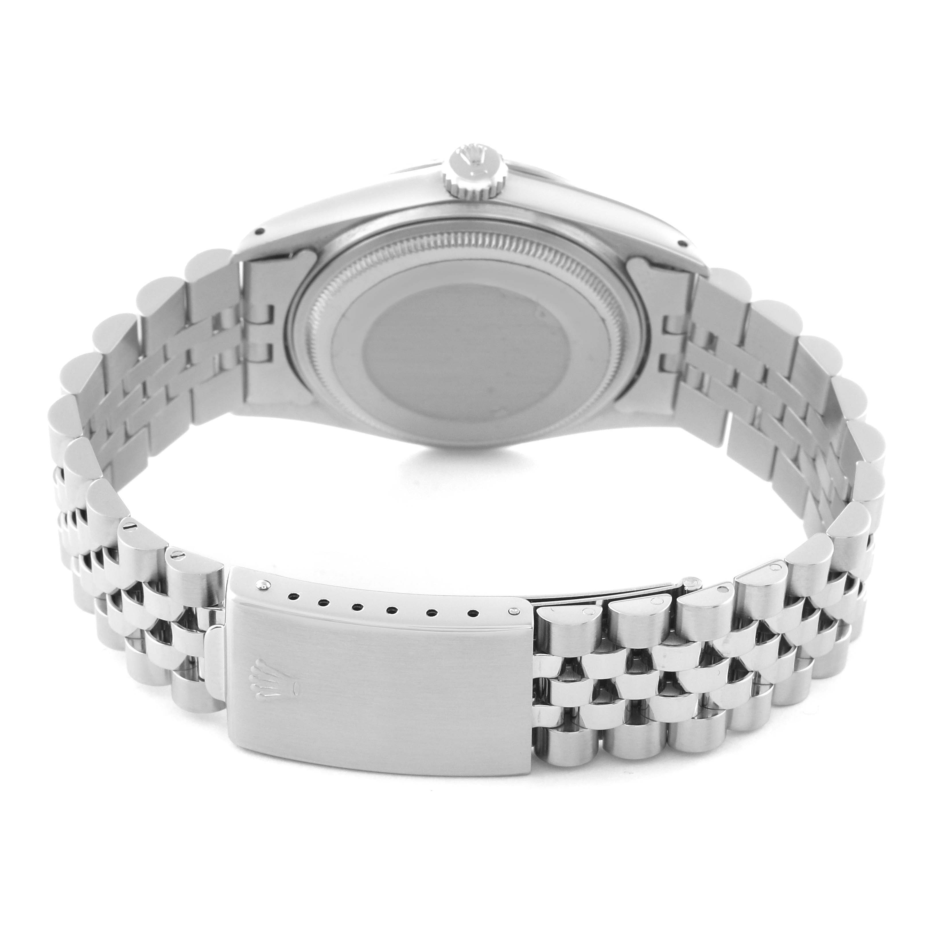 The image shows the back view of a Rolex Vintage Collection 16014 Men's Stainless Steel Silver Dial 16014 Men's Stainless Steel Silver Dial watch, focusing on the case back and metal bracelet with a clasp.