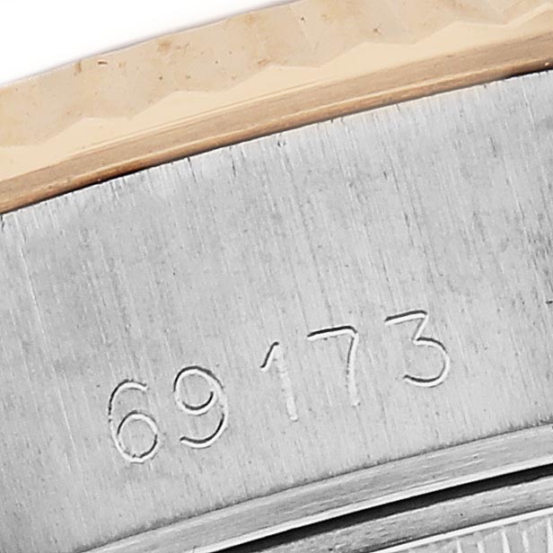 The image shows a close-up of the case side of a Rolex Datejust 69173 Women's Steel and Gold (two tone) Champagne Dial 69173 Women's Steel and Gold (two tone) Champagne Dial watch, displaying its reference number.