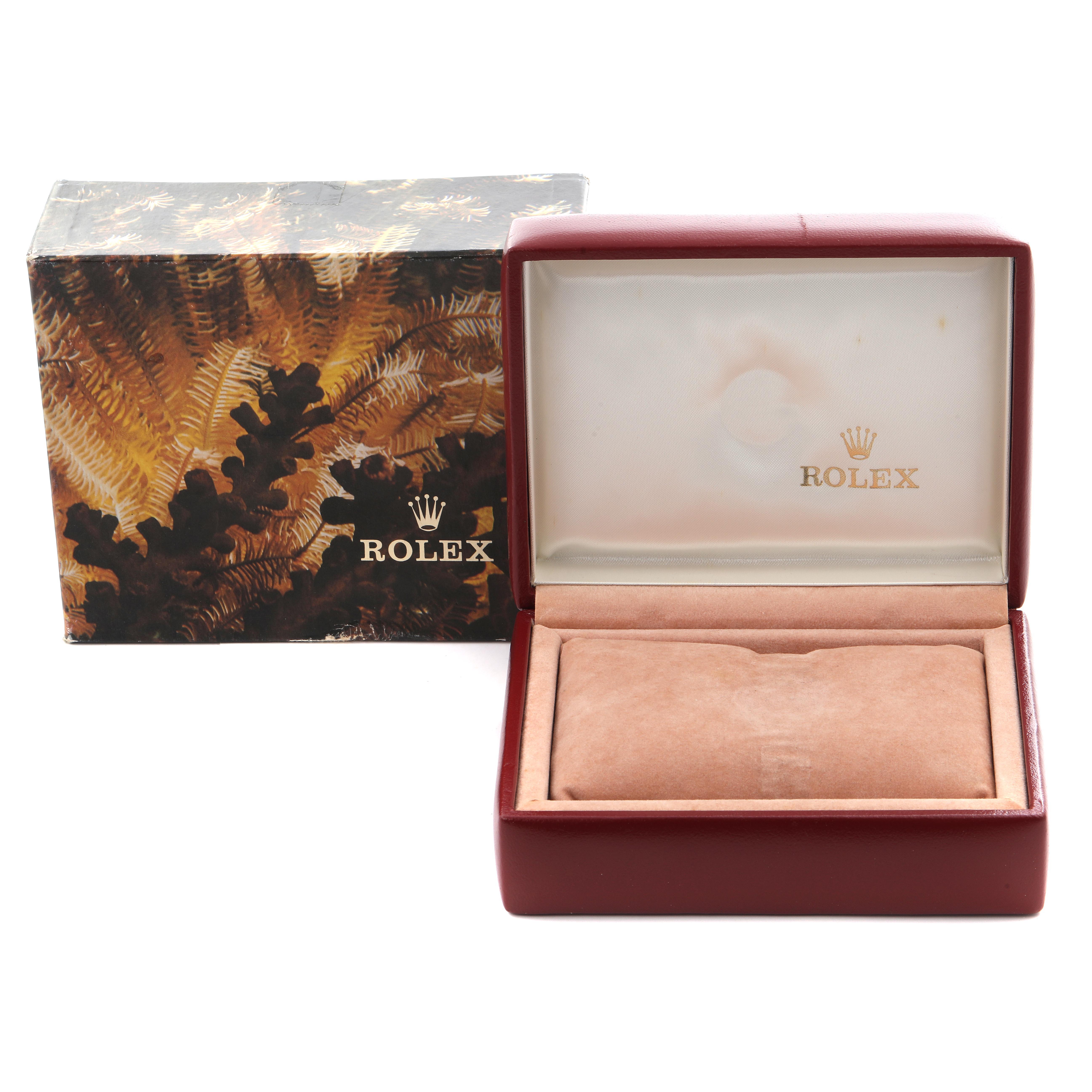 The image shows an open Rolex Datejust 69173 Women's Steel and Gold (two tone) Champagne Dial 69173 Women's Steel and Gold (two tone) Champagne Dial watch box and its outer decorative packaging from a frontal angle.