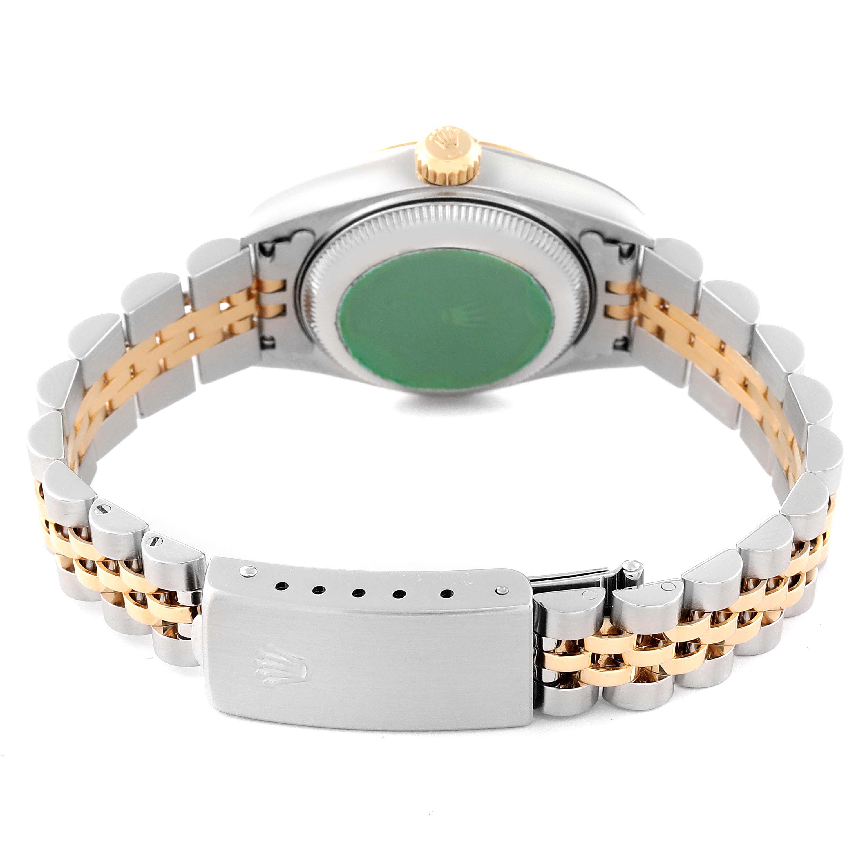 The image shows the underside of a Rolex Datejust 79173 Women's Steel and Gold (two tone) Champagne Dial 79173 Women's Steel and Gold (two tone) Champagne Dial watch, including the case back, crown, and bicolor metal bracelet with clasp.