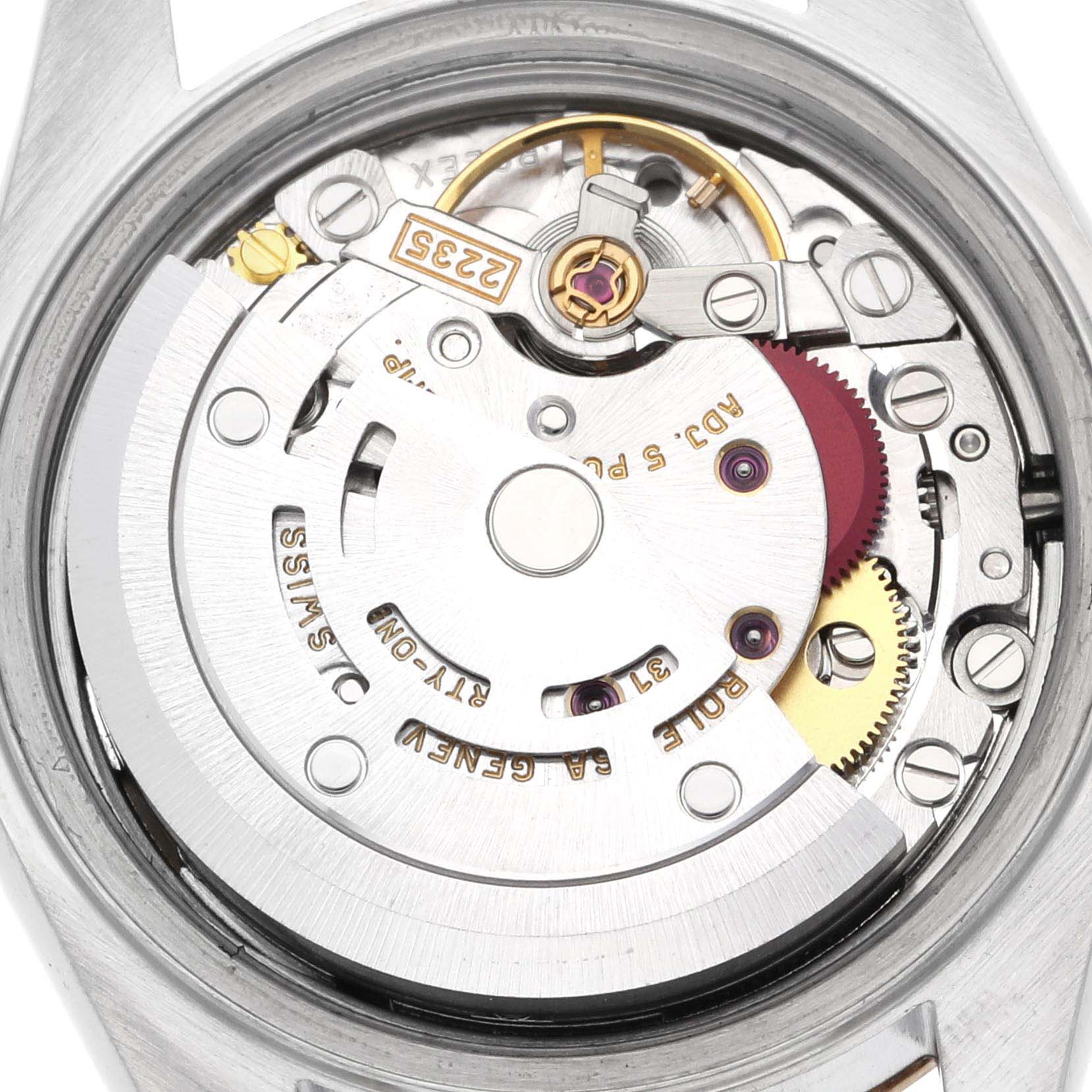 The image shows a close-up of the movement mechanism of a Rolex Datejust 79173 Women's Steel and Gold (two tone) Champagne Dial 79173 Women's Steel and Gold (two tone) Champagne Dial watch, focusing on the intricate gear and rotor assembly.