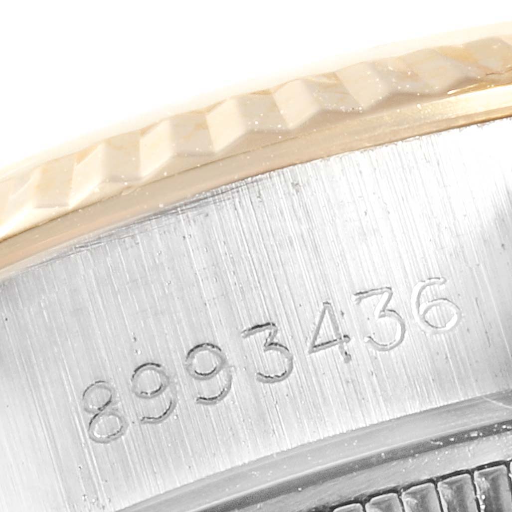 The image shows a close-up of the serial number on the case of a Rolex Datejust 69173 Women
s Steel and Gold (two tone) White Dial 69173 Women
s Steel and Gold (two tone) White Dial watch.