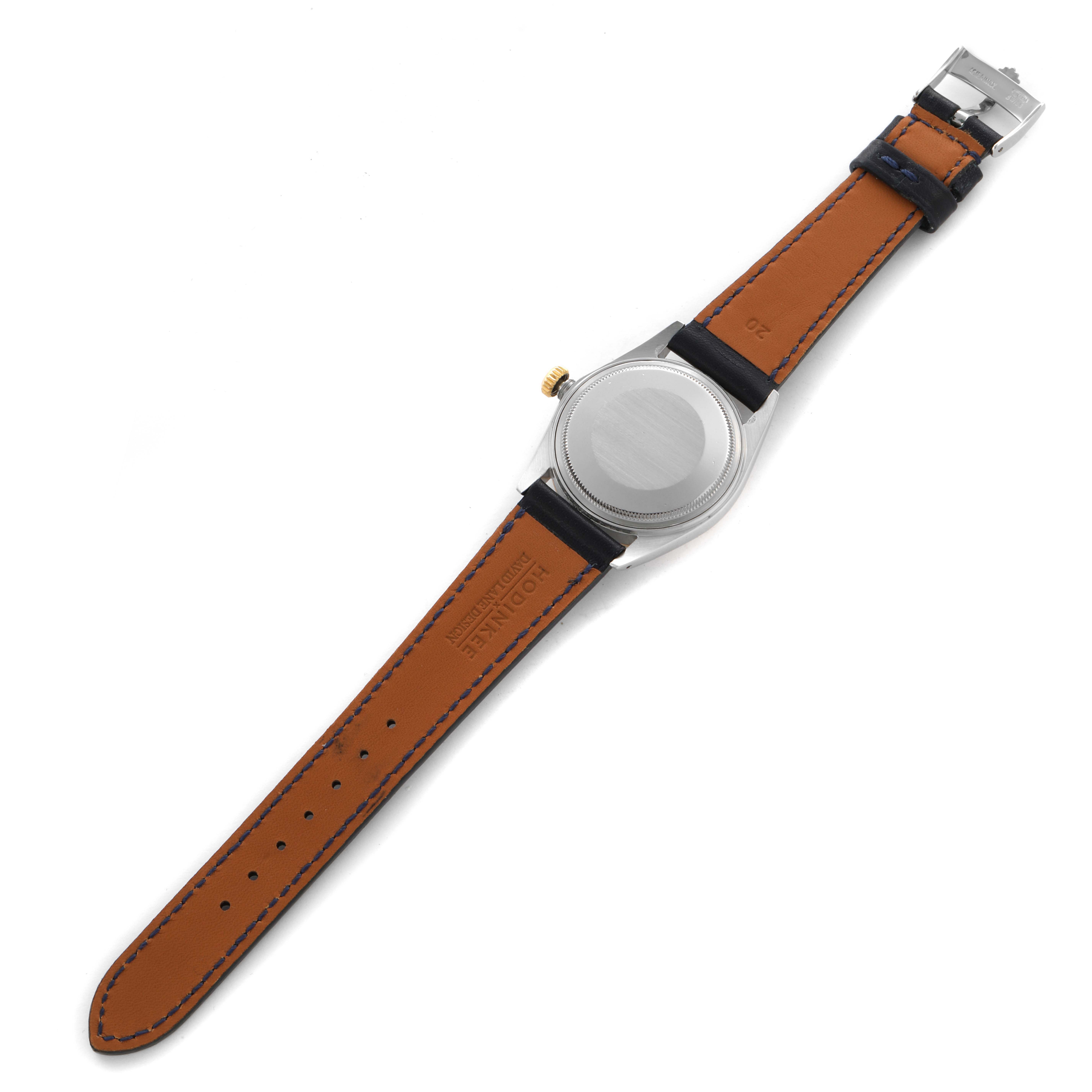 The image shows the back of a Rolex Datejust 16013 Men's Steel and Gold (two tone) Champagne Dial 16013 Men's Steel and Gold (two tone) Champagne Dial watch, including the case, crown, and leather strap from a top-down angle.