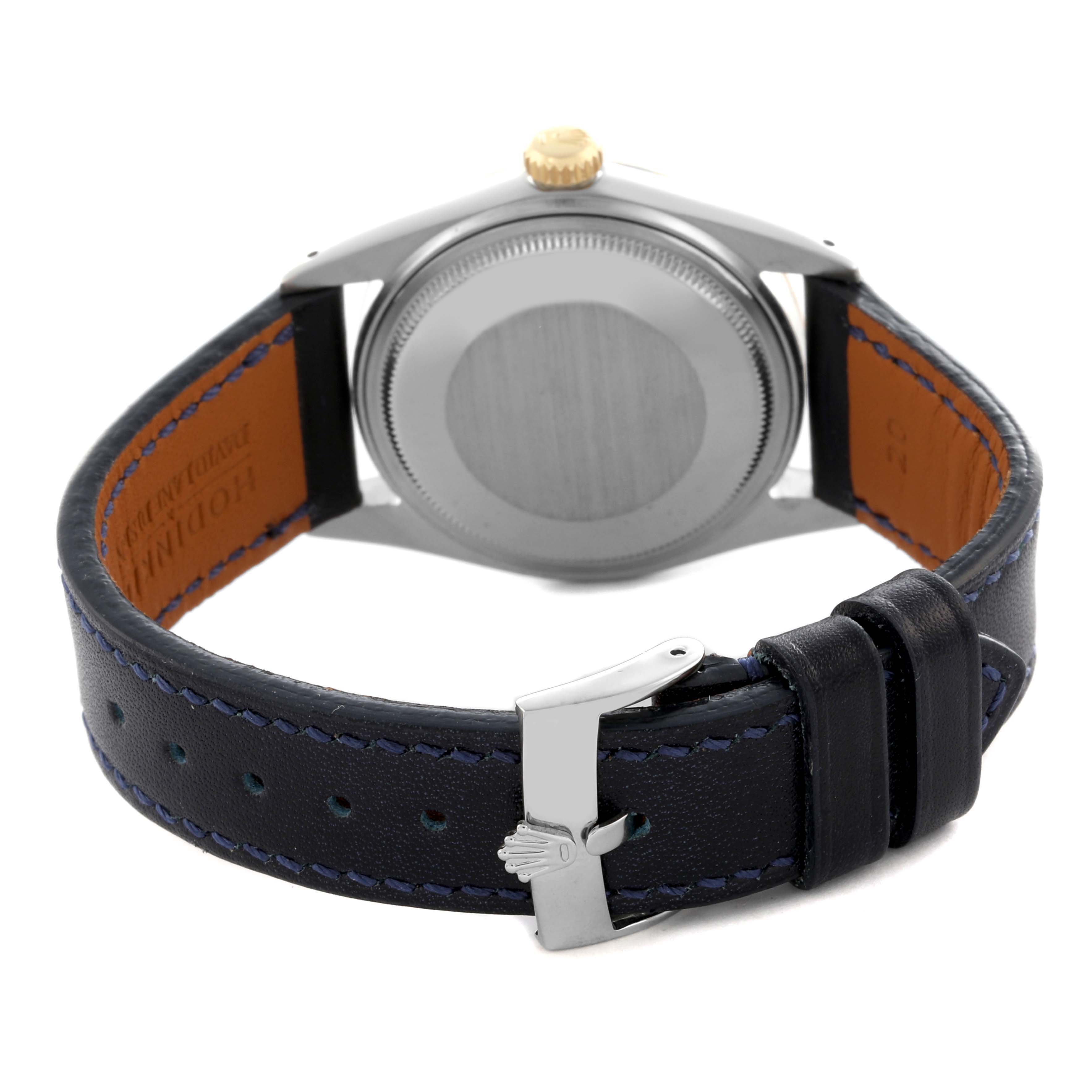 The image shows the back and side view of a Rolex Datejust 16013 Men's Steel and Gold (two tone) Champagne Dial 16013 Men's Steel and Gold (two tone) Champagne Dial watch, highlighting the case, crown, and leather strap with a clasp.