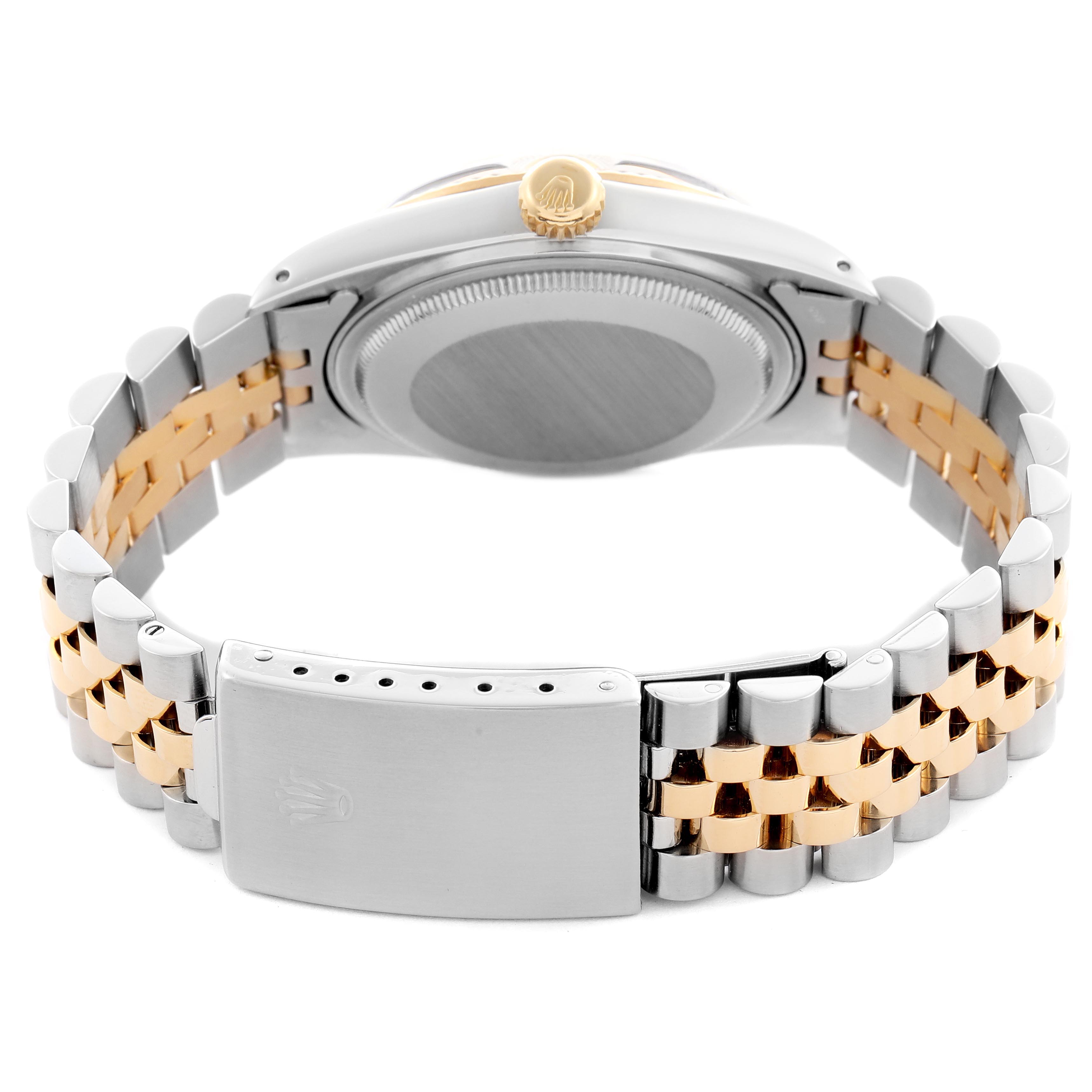 The Rolex Datejust 16013 Men's Steel and Gold (two tone) Champagne Dial 16013 Men's Steel and Gold (two tone) Champagne Dial is shown from the back, highlighting the clasp, bracelet, case back, and crown.