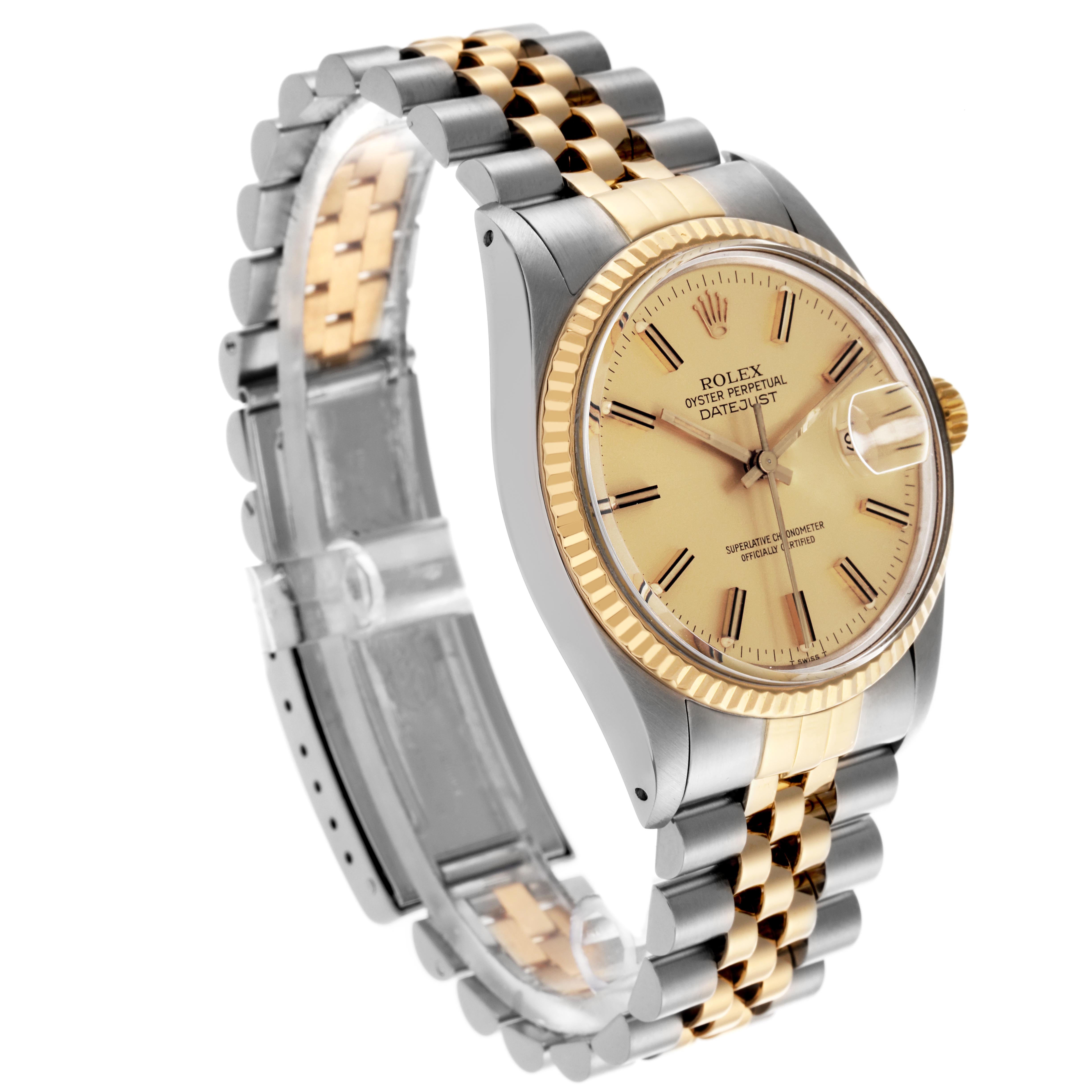 The Rolex Datejust 16013 Men's Steel and Gold (two tone) Champagne Dial 16013 Men's Steel and Gold (two tone) Champagne Dial is shown at a slight angle highlighting the face, bezel, crown, and two-tone bracelet.