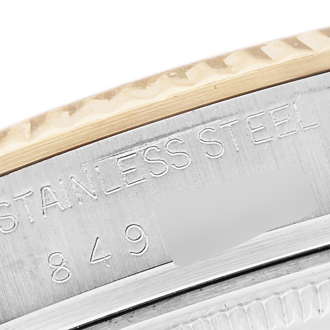 The image shows a close-up of the side view of a Rolex Datejust 16013 Men's Steel and Gold (two tone) Champagne Dial 16013 Men's Steel and Gold (two tone) Champagne Dial, highlighting the stainless steel and gold bezel.