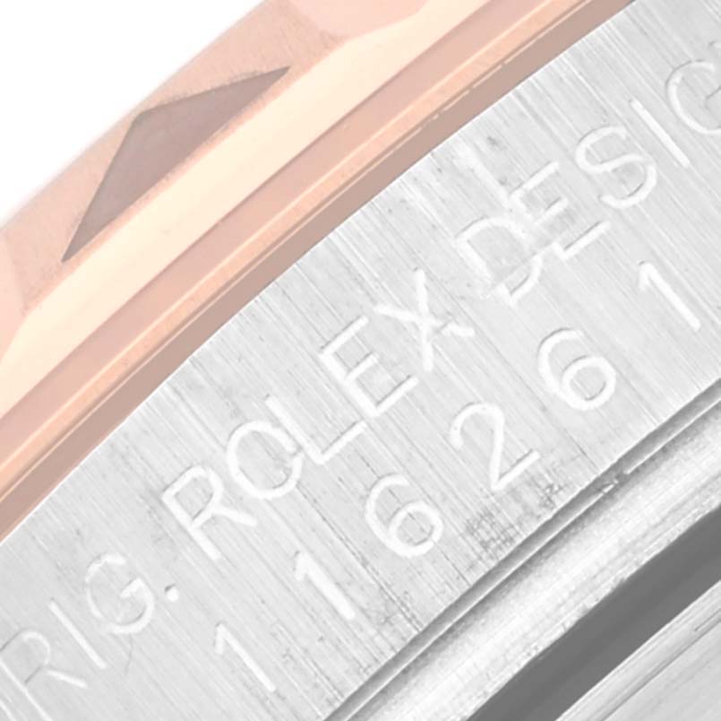 This close-up image of the Rolex Turn-o-Graph 116261 Men's Steel and Gold (two tone) Black Dial 116261 Men's Steel and Gold (two tone) Black Dial shows the engraved model number on the watch case and the edge of the bezel.