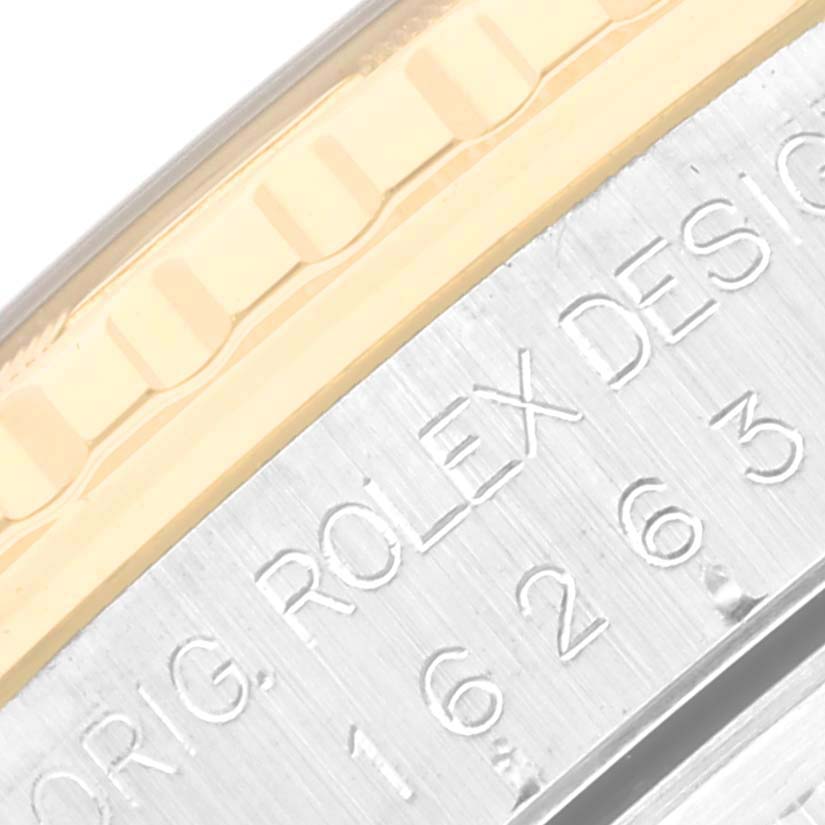 The image shows a close-up angle of the bezel and engraved serial number on a Rolex Turn-o-Graph 16263 Men's Steel and Gold (two tone) White Dial 16263 Men's Steel and Gold (two tone) White Dial watch.