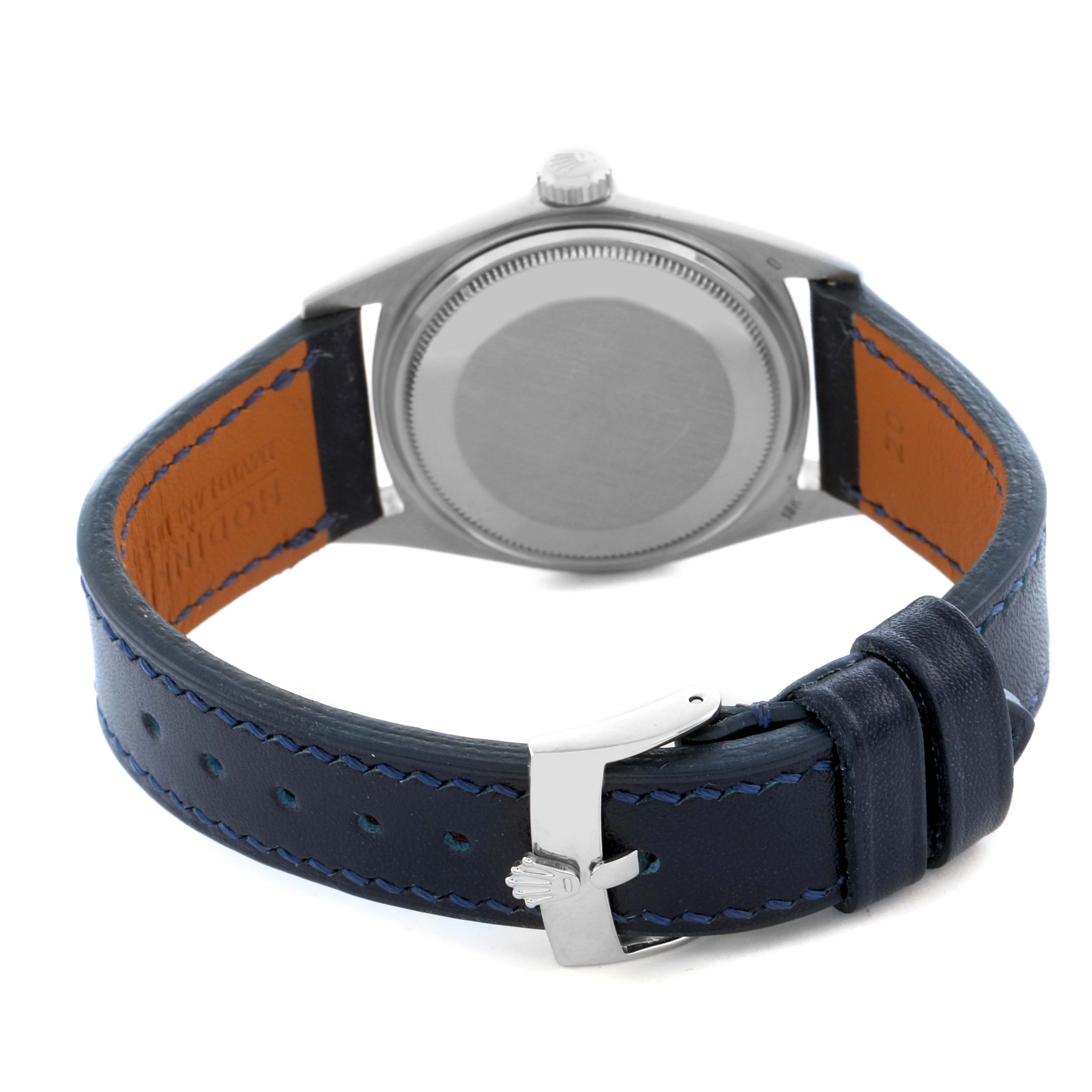 This image shows the back of a Rolex President 1803 Men's White Gold Silver Dial 1803 Men's White Gold Silver Dial watch, highlighting the case back, crown, and leather strap with a buckle.