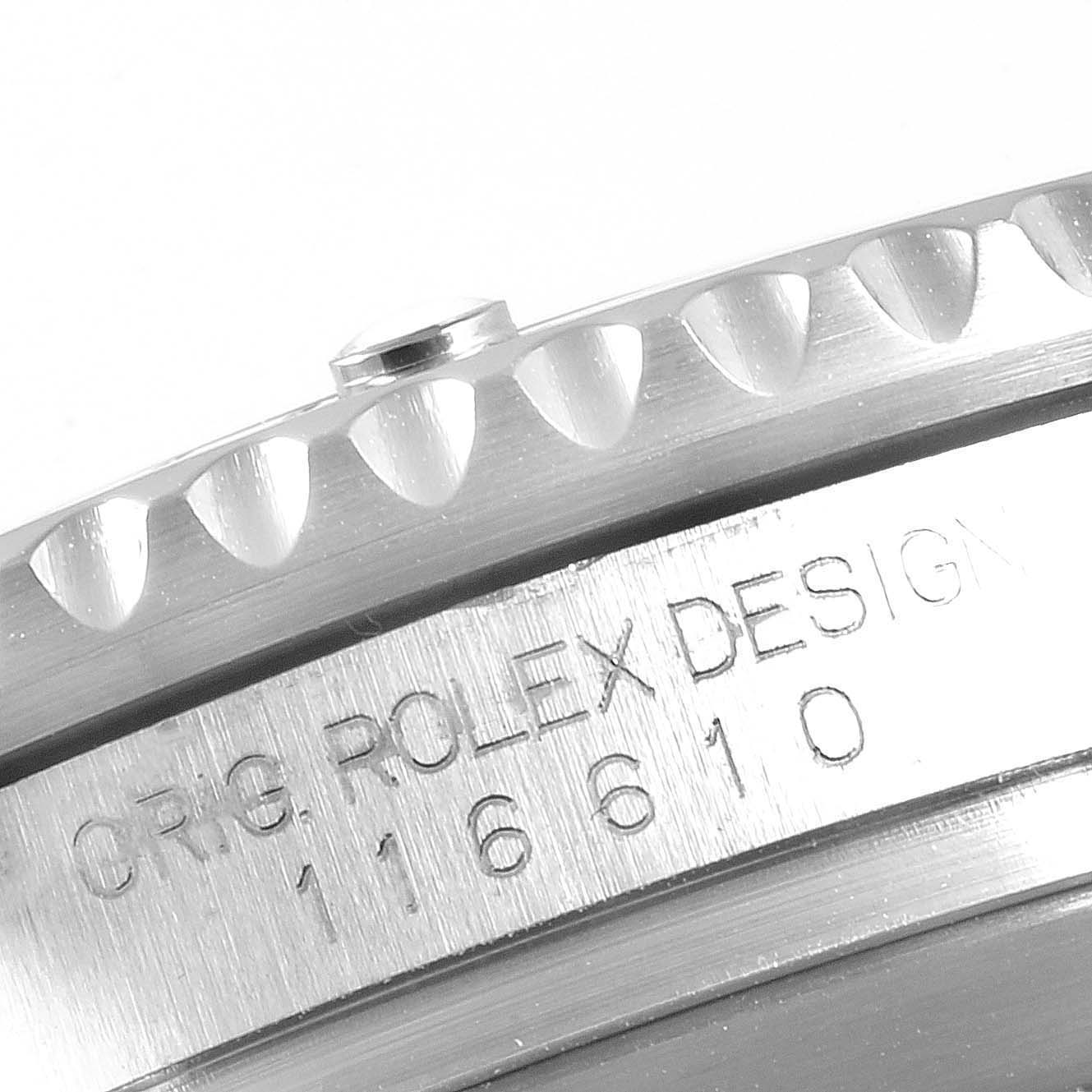 The image shows a close-up of the Rolex Daytona 116520 Men's Stainless Steel Black Dial 116520 Men's Stainless Steel Black Dial's case side, showcasing the bezel and engraved design details.