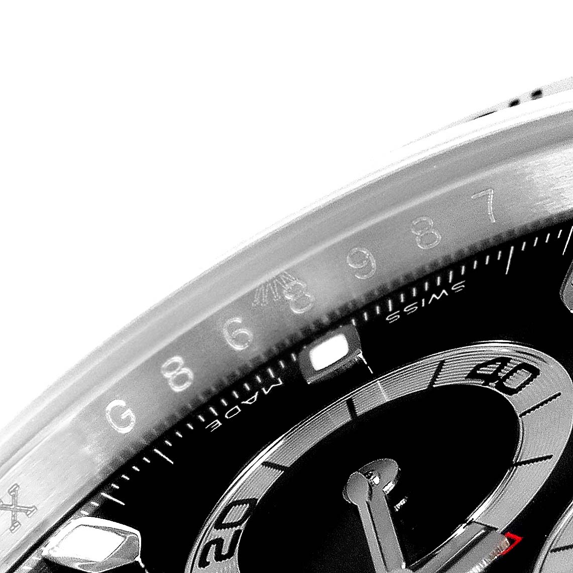 The image shows a close-up of the dial and bezel of a Rolex Daytona 116520 Men's Stainless Steel Black Dial 116520 Men's Stainless Steel Black Dial watch, highlighting its detailed markings and indices.