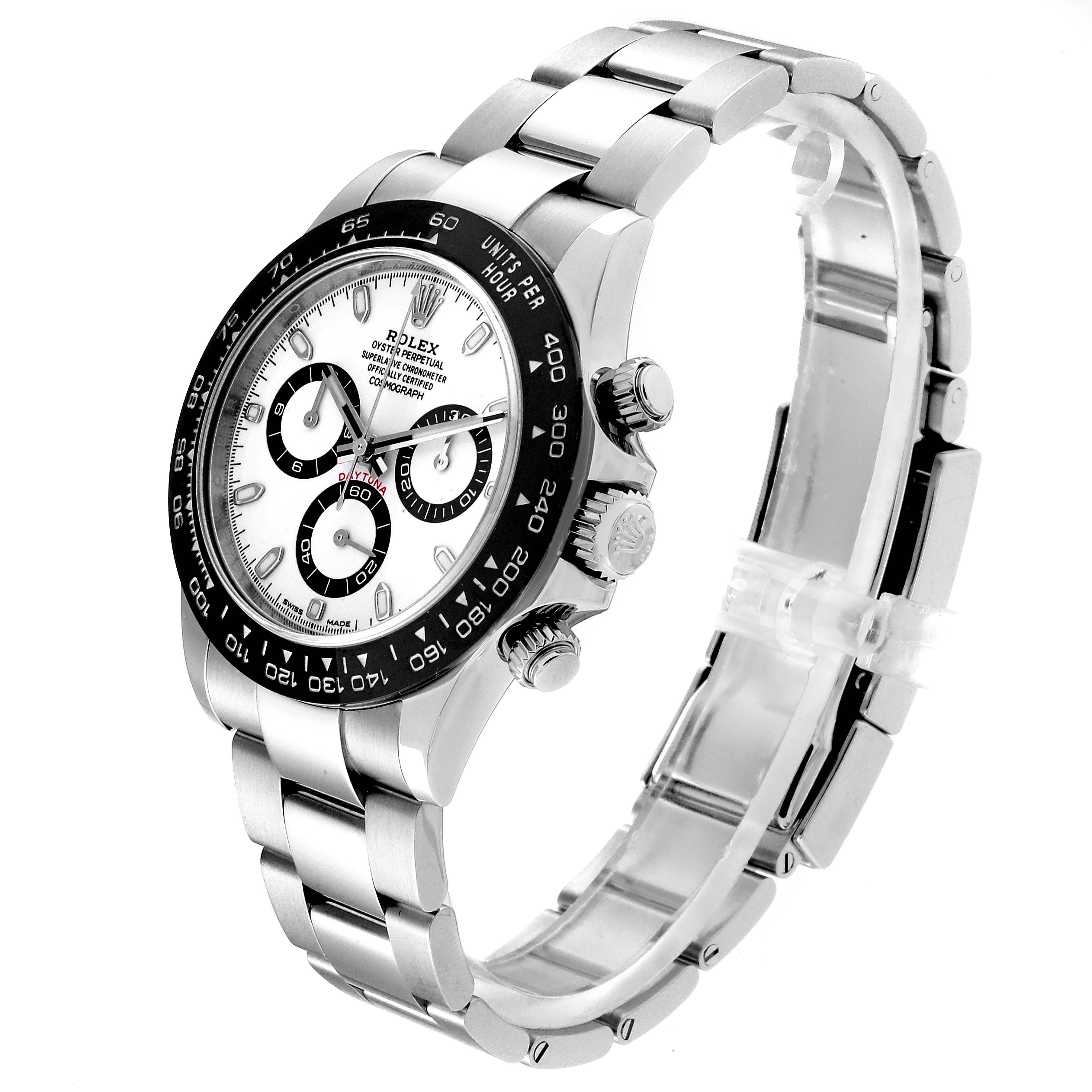 The Rolex Daytona 116500 Men's Stainless Steel White Dial 116500 Men's Stainless Steel White Dial watch is shown at an angle highlighting the face, bezel, pushers, crown, and bracelet.