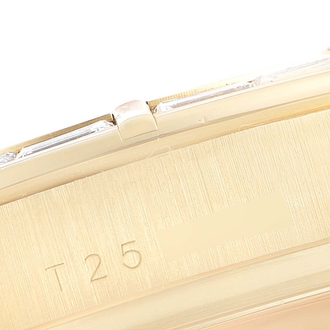 This image shows a close-up of the side edge of a Rolex Daytona 16568 Men's Yellow Gold Black Dial 16568 Men's Yellow Gold Black Dial watch, focusing on the engraved "T25" marking.