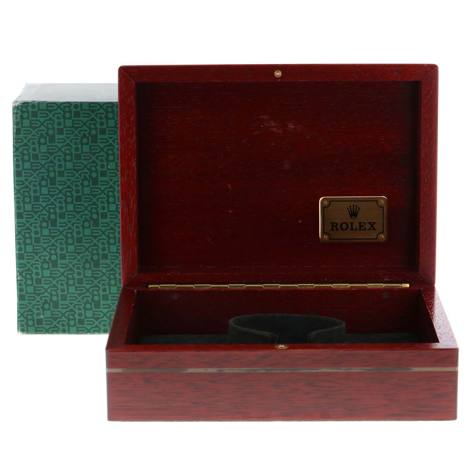 The image shows an empty Rolex wooden watch box for the Daytona model, open with a green outer box beside it.