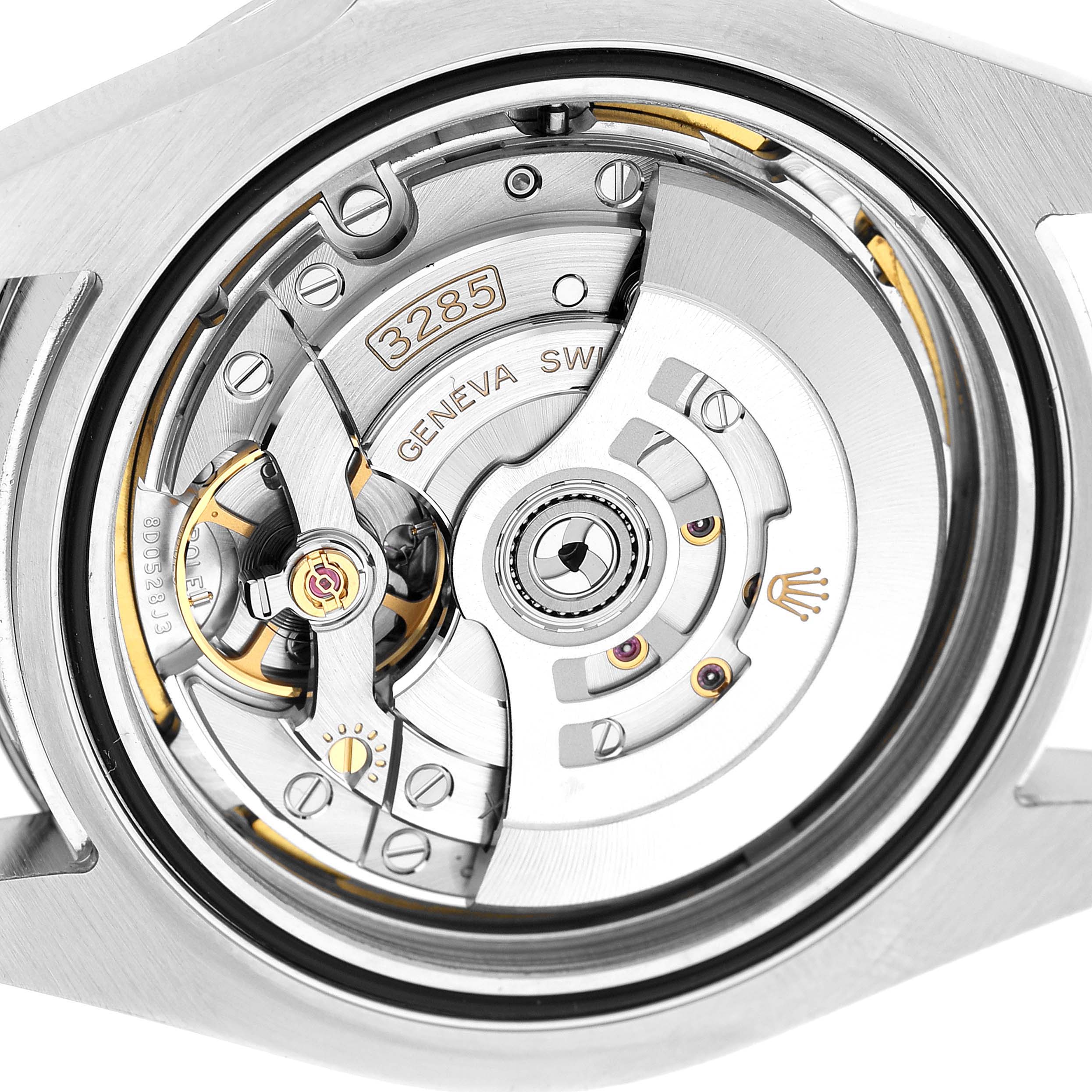 The image shows the movement of a Rolex Explorer 226570 Men's Stainless Steel Black Dial watch from the back, highlighting the rotor and intricate mechanics.