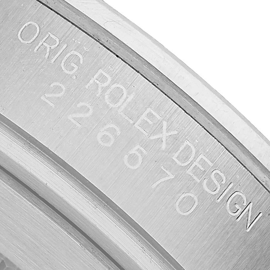 The image shows a close-up of the engraved case back of a Rolex Explorer 226570 Men's Stainless Steel Black Dial watch.
