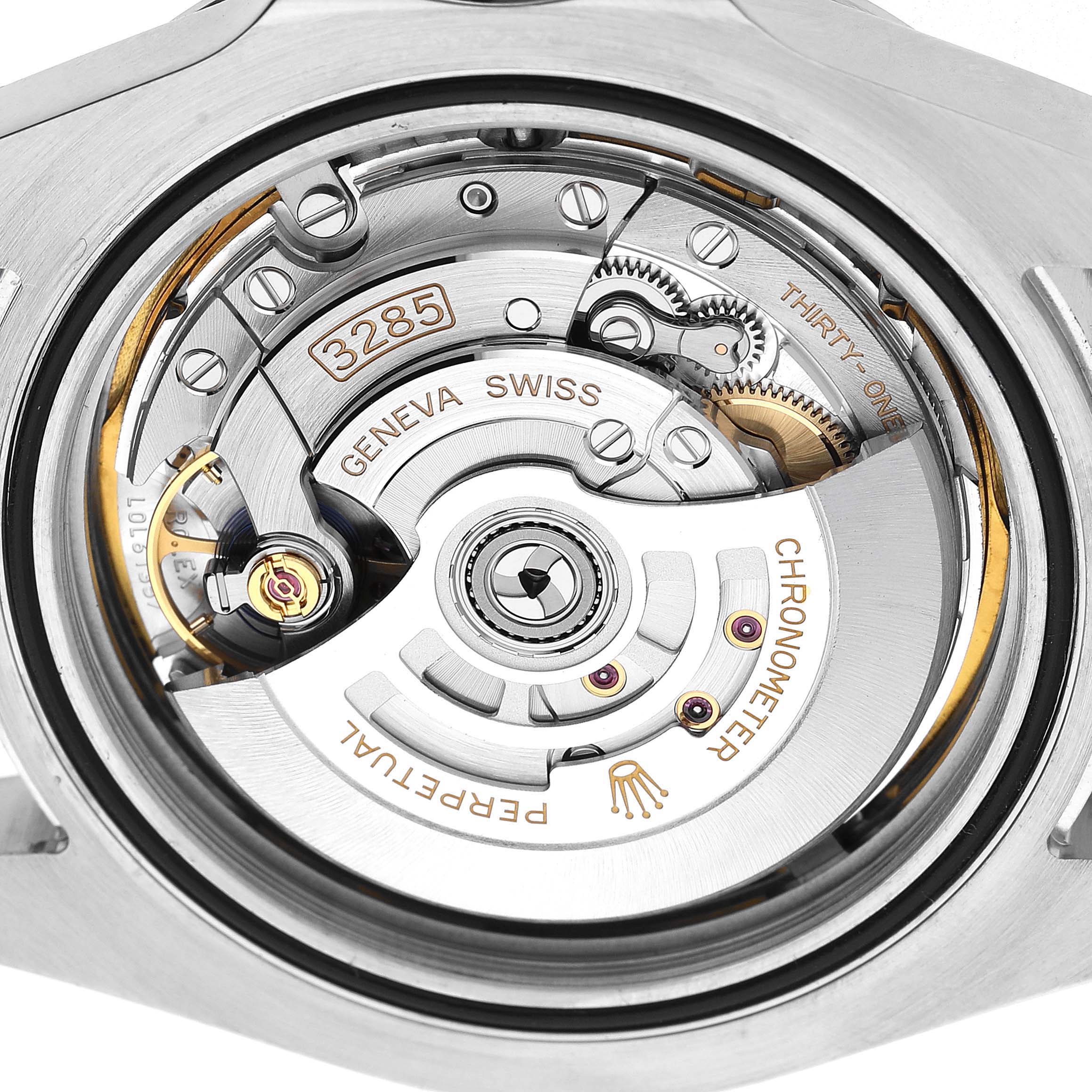 The image shows the Rolex Explorer M226570-001 Men's Stainless Steel White Dial's movement mechanism from a rear angle, highlighting the intricate gears and rotors.