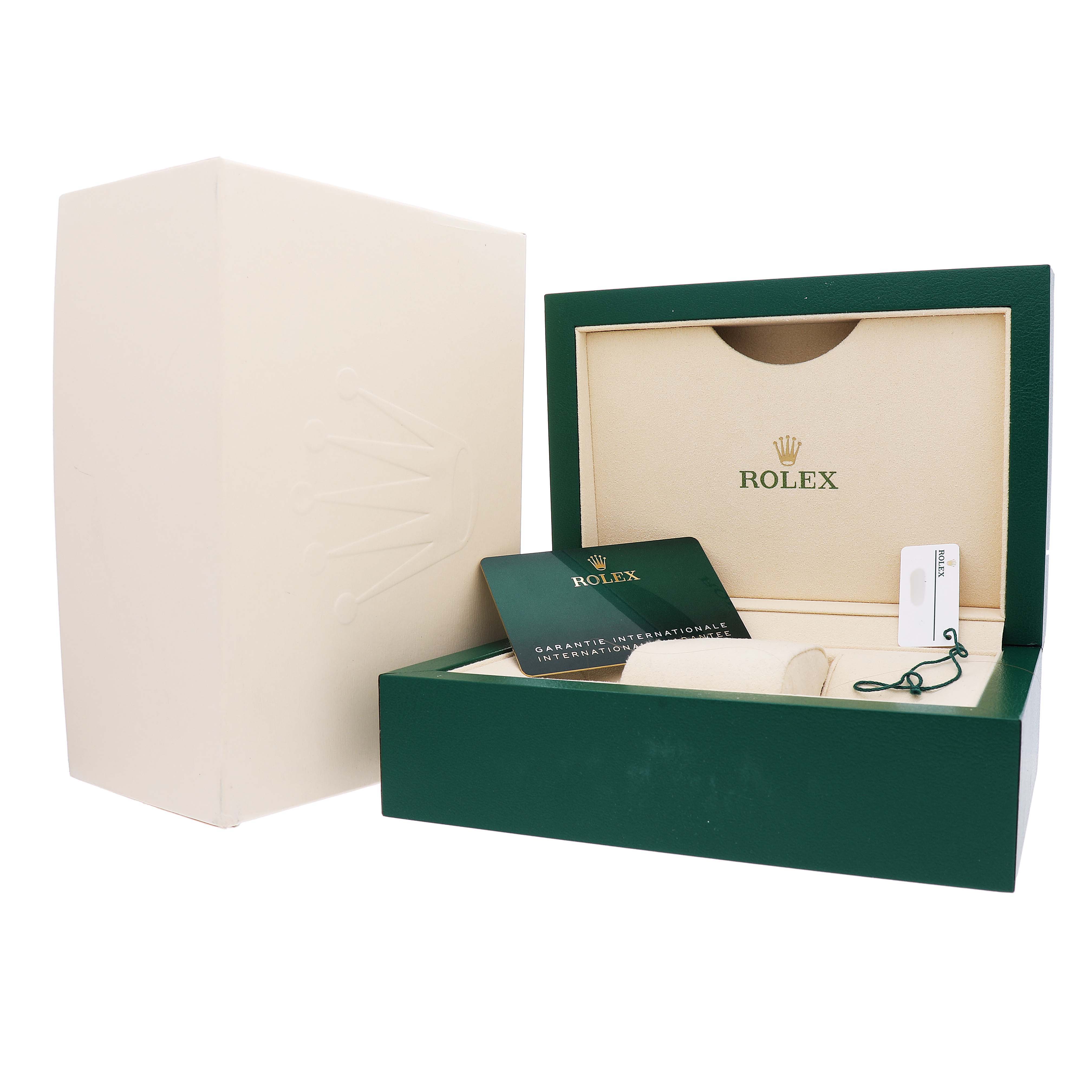 The image shows the open box, warranty card, and packaging for the Rolex Explorer M226570-001 Men's Stainless Steel White Dial watch.