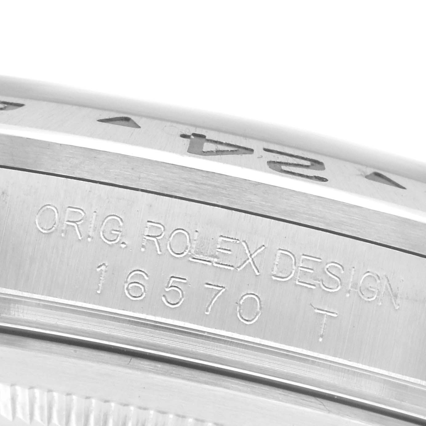 The image shows a close-up of the side of a Rolex Explorer 16570T Men's Stainless Steel Black Dial 16570T Men's Stainless Steel Black Dial, highlighting the case with engraved text.