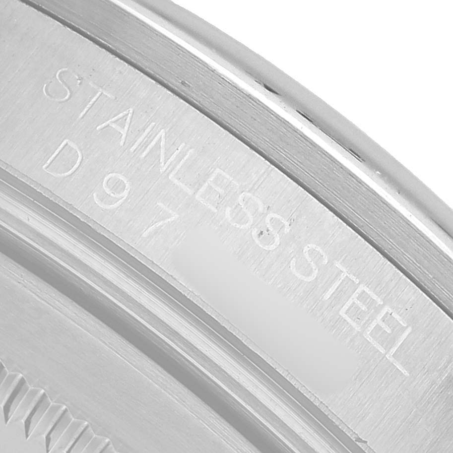 The image shows a close-up of the engraved stainless steel back of a Rolex Explorer 16570T Men's Stainless Steel Black Dial watch.