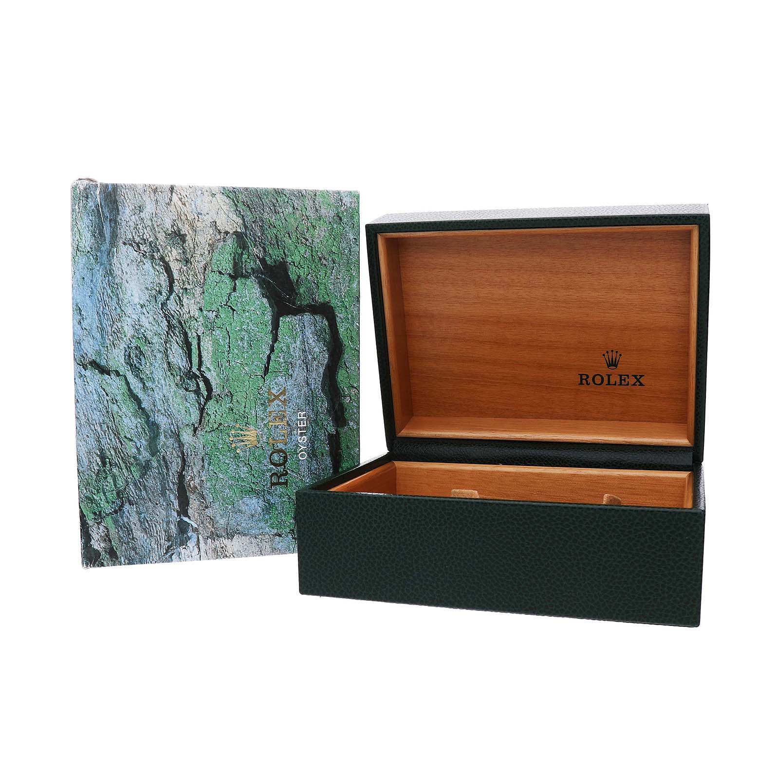 The image shows a Rolex Explorer 16570T Men's Stainless Steel Black Dial packaging, including an open green textured box and a nature-themed booklet.