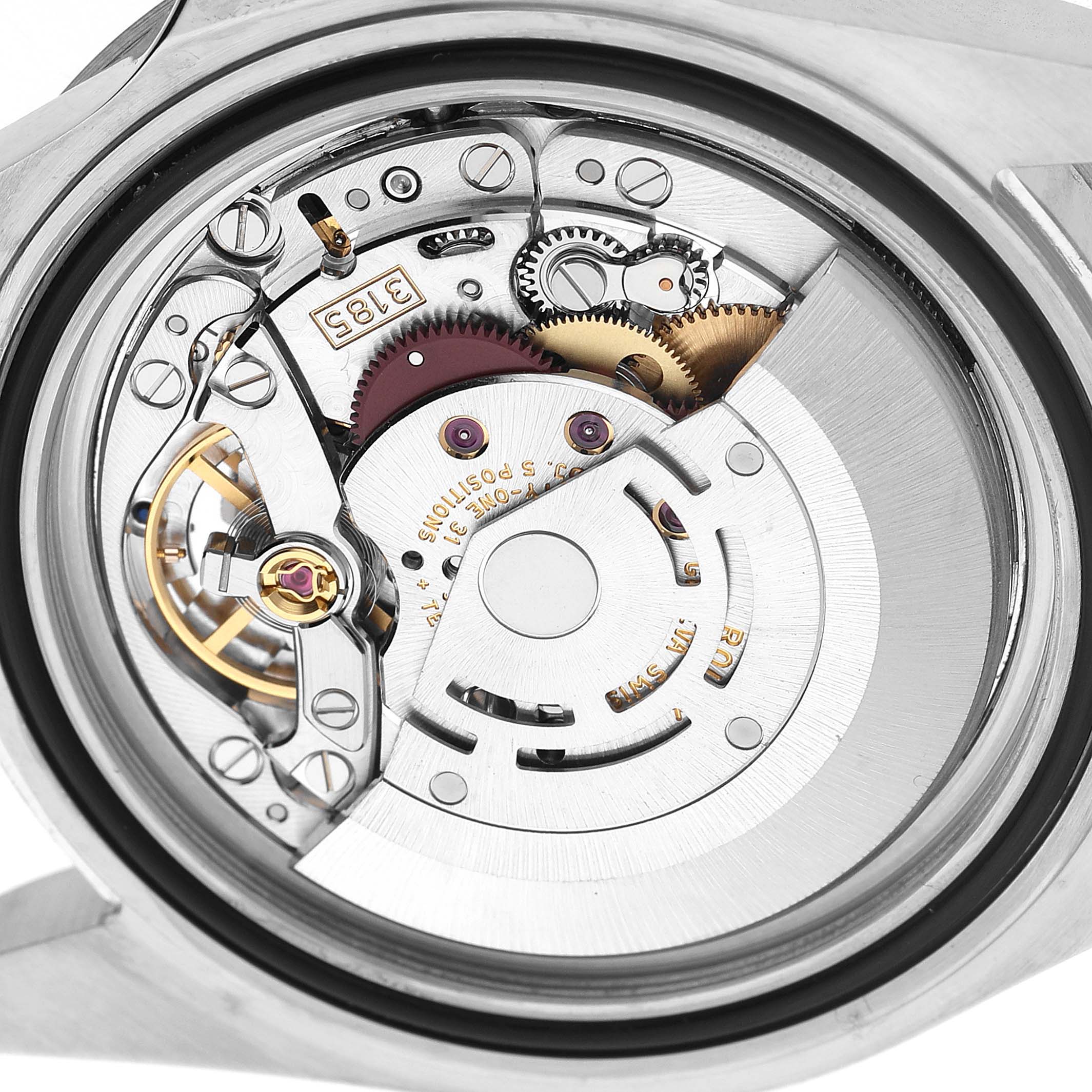 The image shows the movement mechanism of the Rolex Explorer 16570T Men's Stainless Steel Black Dial from the back, highlighting gears and the oscillating weight.