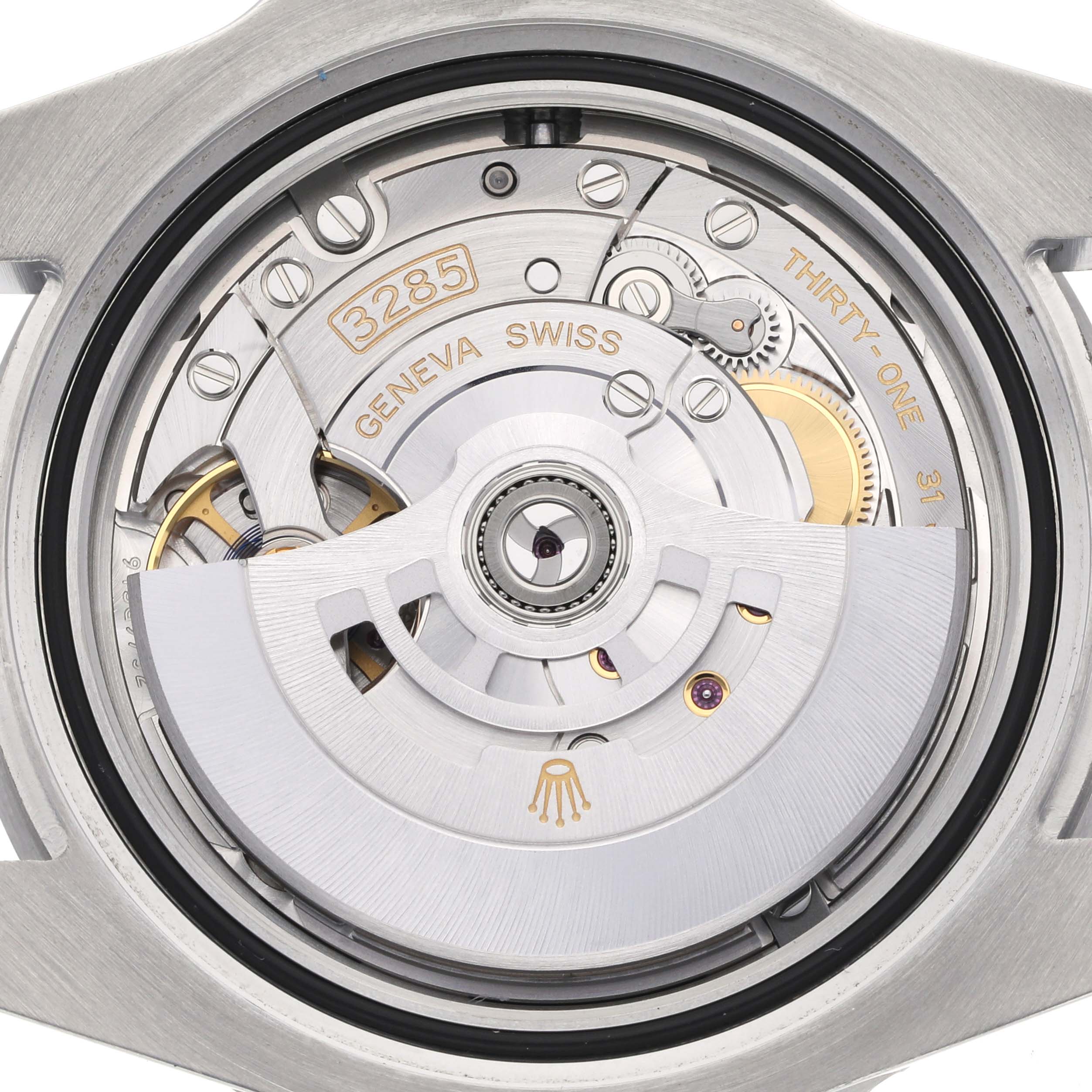 This image shows the movement of a Rolex GMT-Master 126710BLRO Men's Stainless Steel Black Dial 126710BLRO Men's Stainless Steel Black Dial, focusing on the intricate mechanical parts and engravings of the case back.