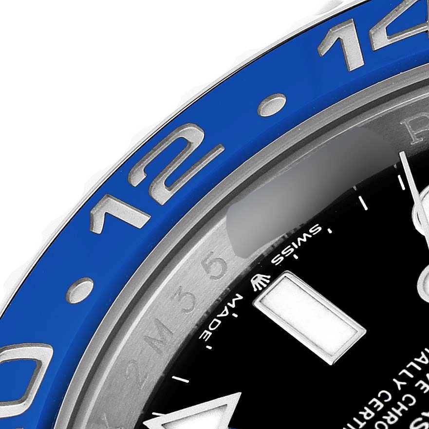 The image shows a close-up angle of the Rolex GMT-Master 126710BLNR Men's Stainless Steel Black Dial's blue bezel, indices, and part of the dial.