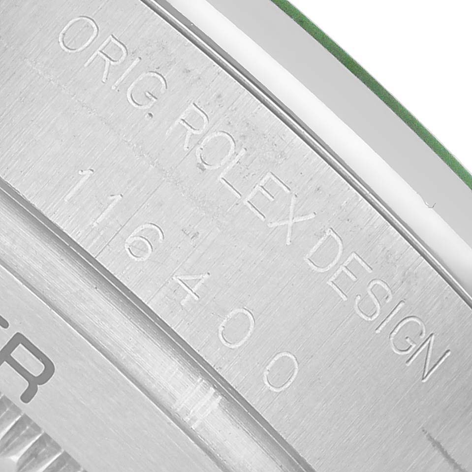 The image shows a close-up of the engraved case side of a Rolex Milgauss 116400GV Men's Stainless Steel Black Dial watch, featuring the model number 116400.