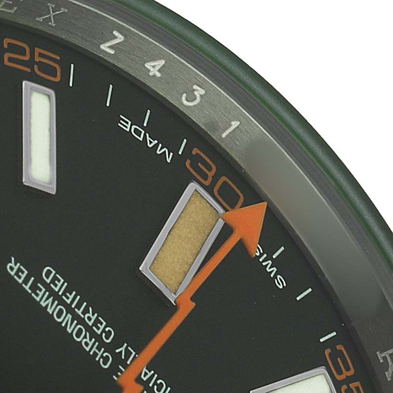 The image shows a close-up angle of the Rolex Milgauss 116400GV Men's Stainless Steel Black Dial watch face, highlighting the hour marker, numbers, and second hand.