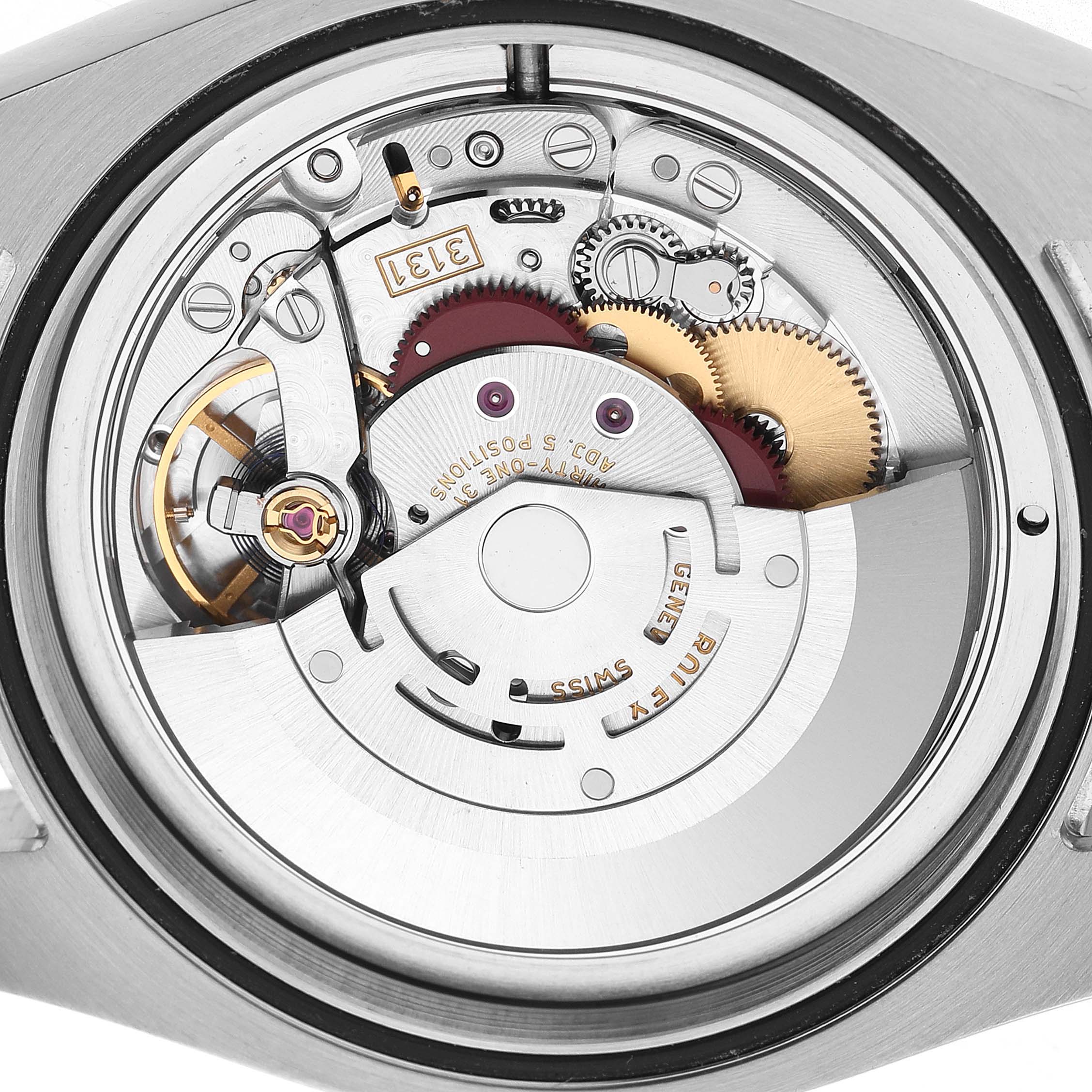 The image shows the movement mechanism of a Rolex Milgauss 116400GV Men's Stainless Steel Black Dial watch with gears and components visible from the back.