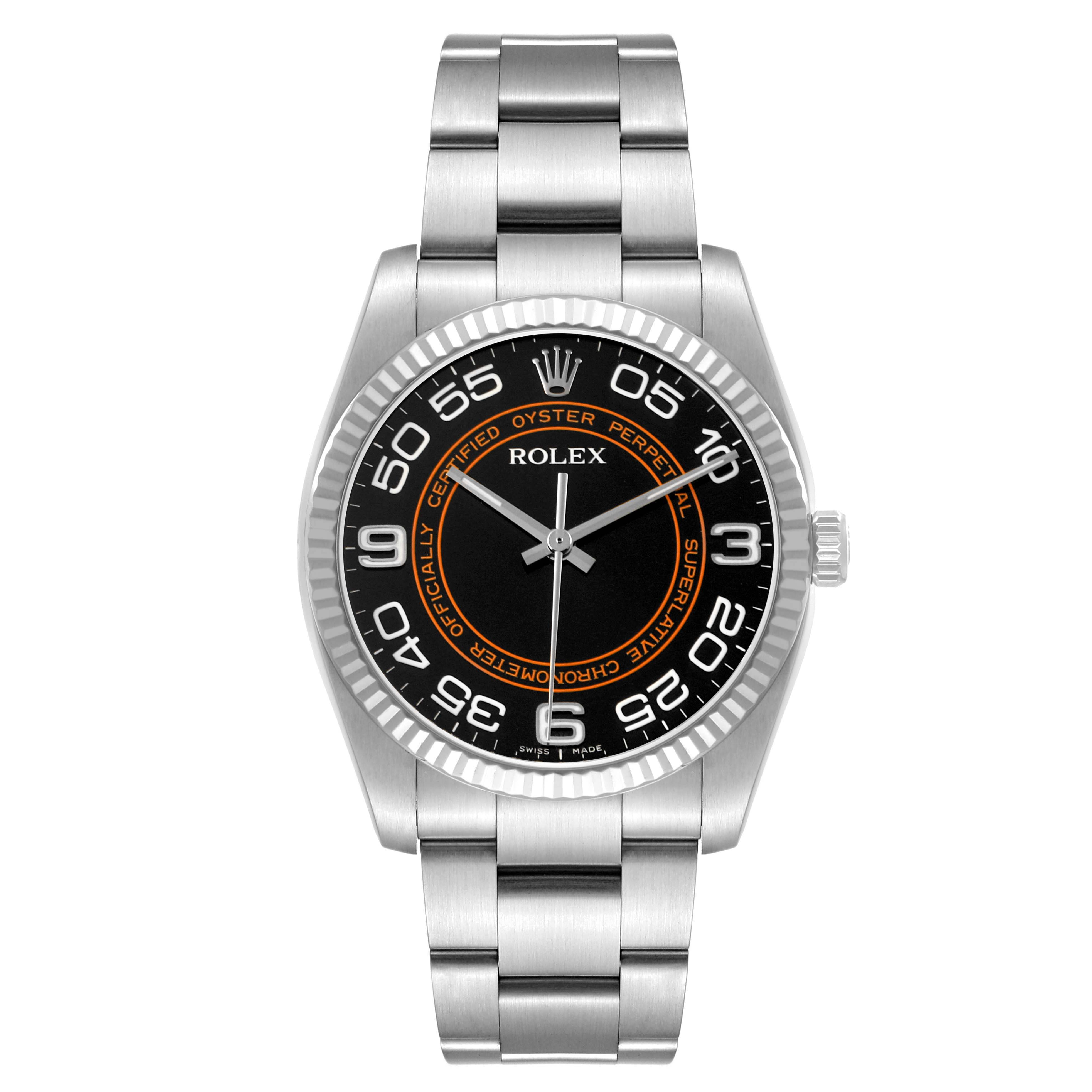 The Rolex Oyster Perpetual 116034 Men's Stainless Steel Black Dial watch is shown from a top-down angle, displaying its face, bezel, and metal bracelet clearly.