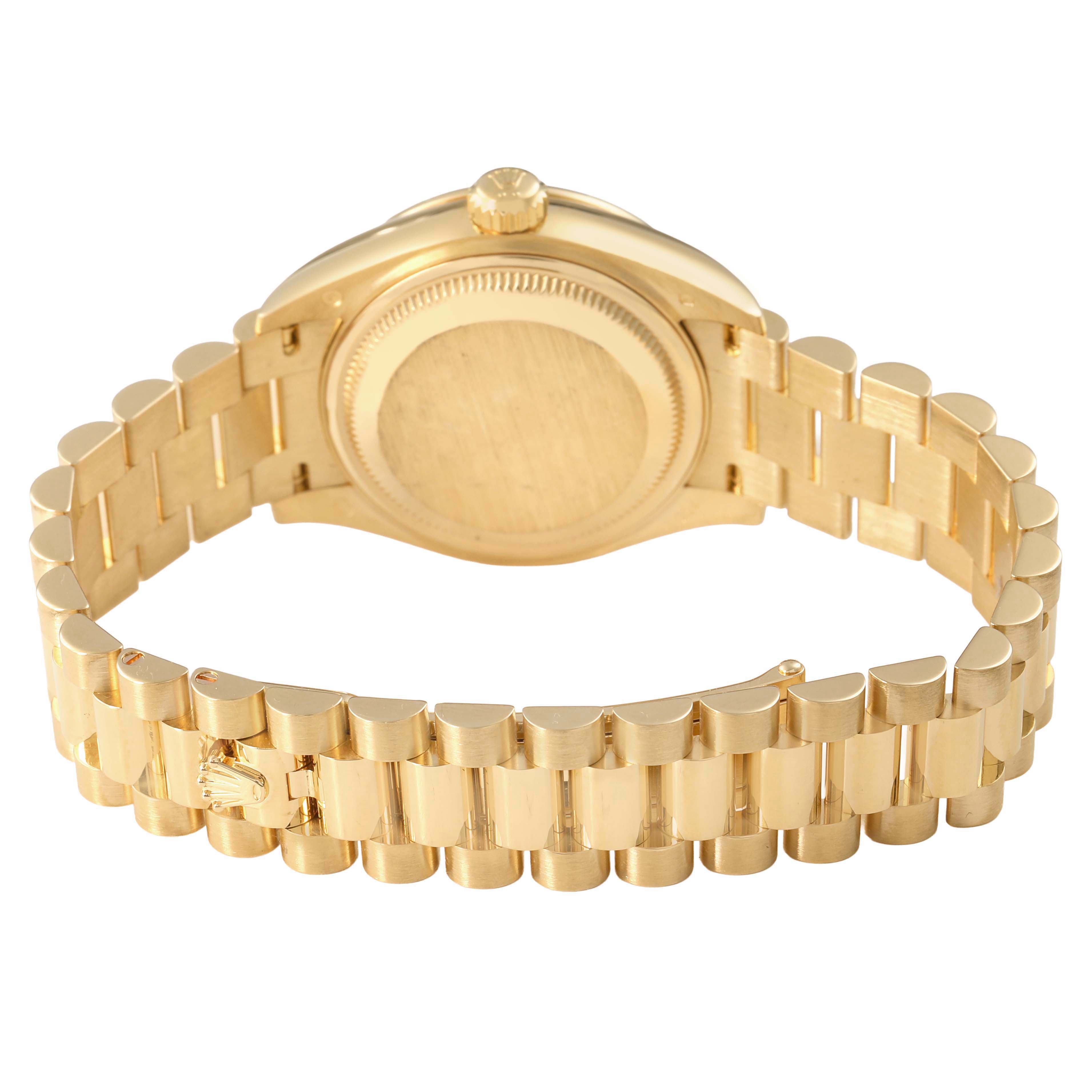 The image shows the backside and bracelet of a Rolex President 279138 Women's Yellow Gold Champagne Dial model, focusing on the clasp and case back.