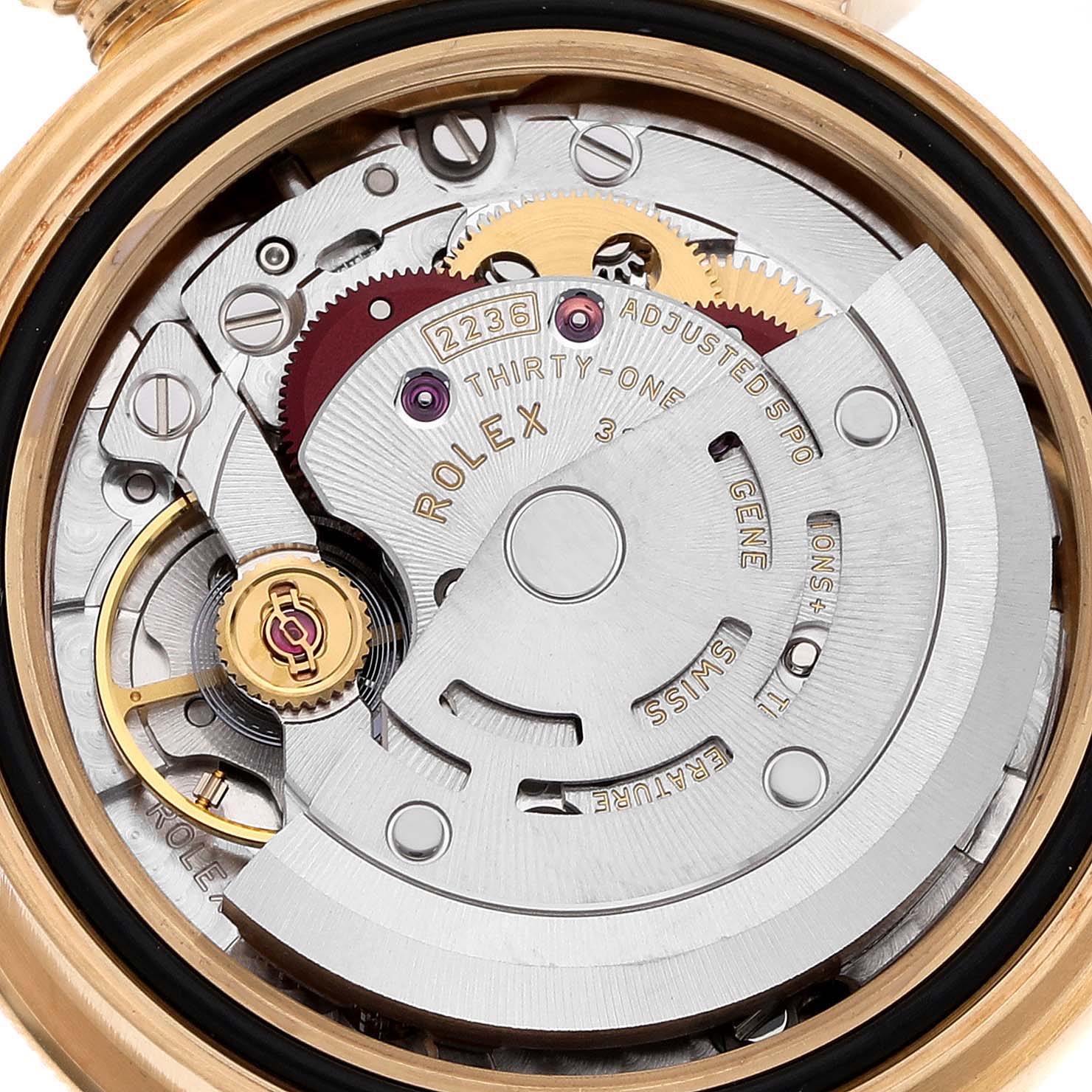 The image shows a close-up of the inner mechanism of a Rolex President 279138 Women's Yellow Gold Champagne Dial model watch, highlighting gears and the rotor.